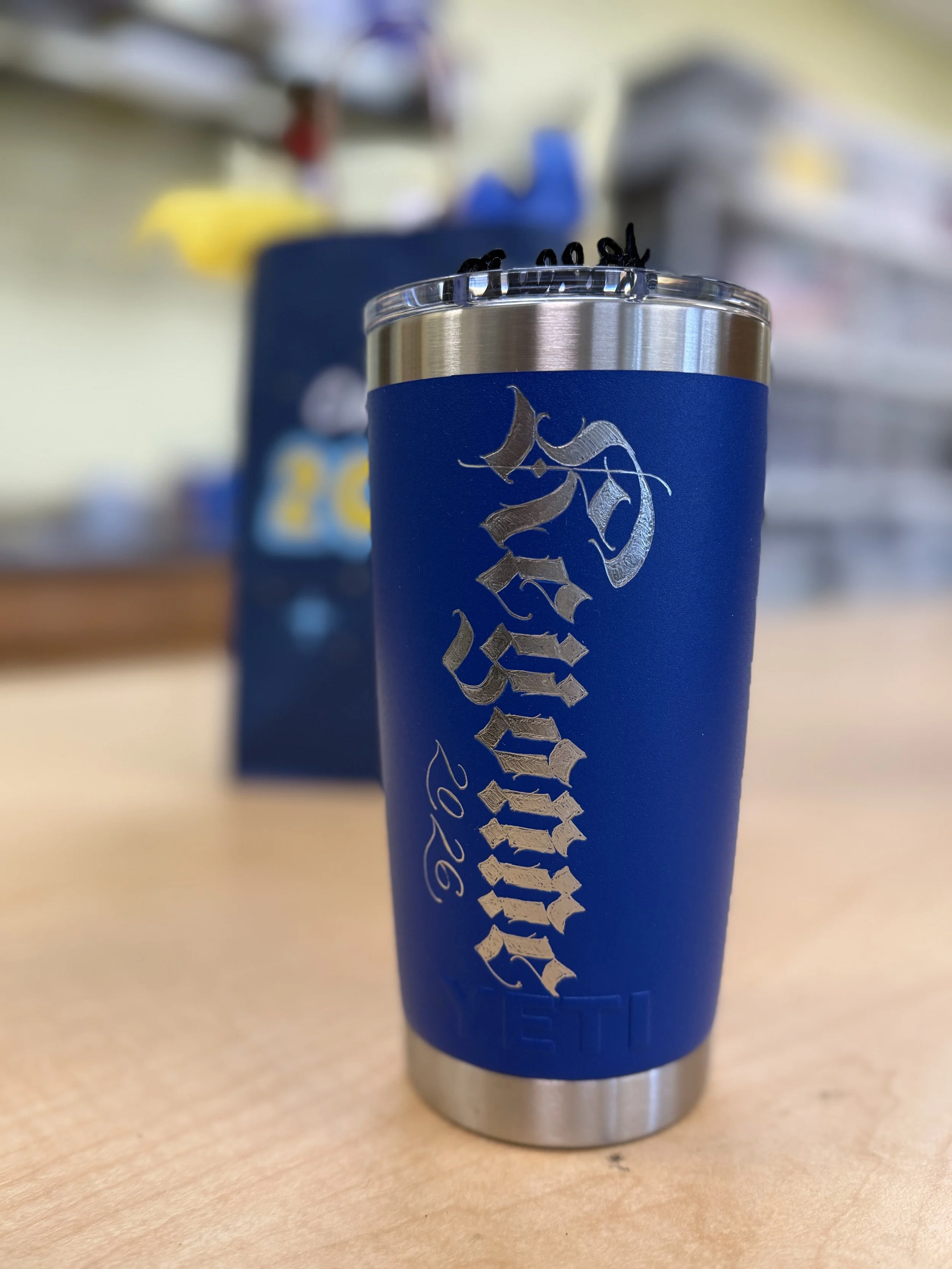 blue tumbler with keyonne engraved in textura blackletter