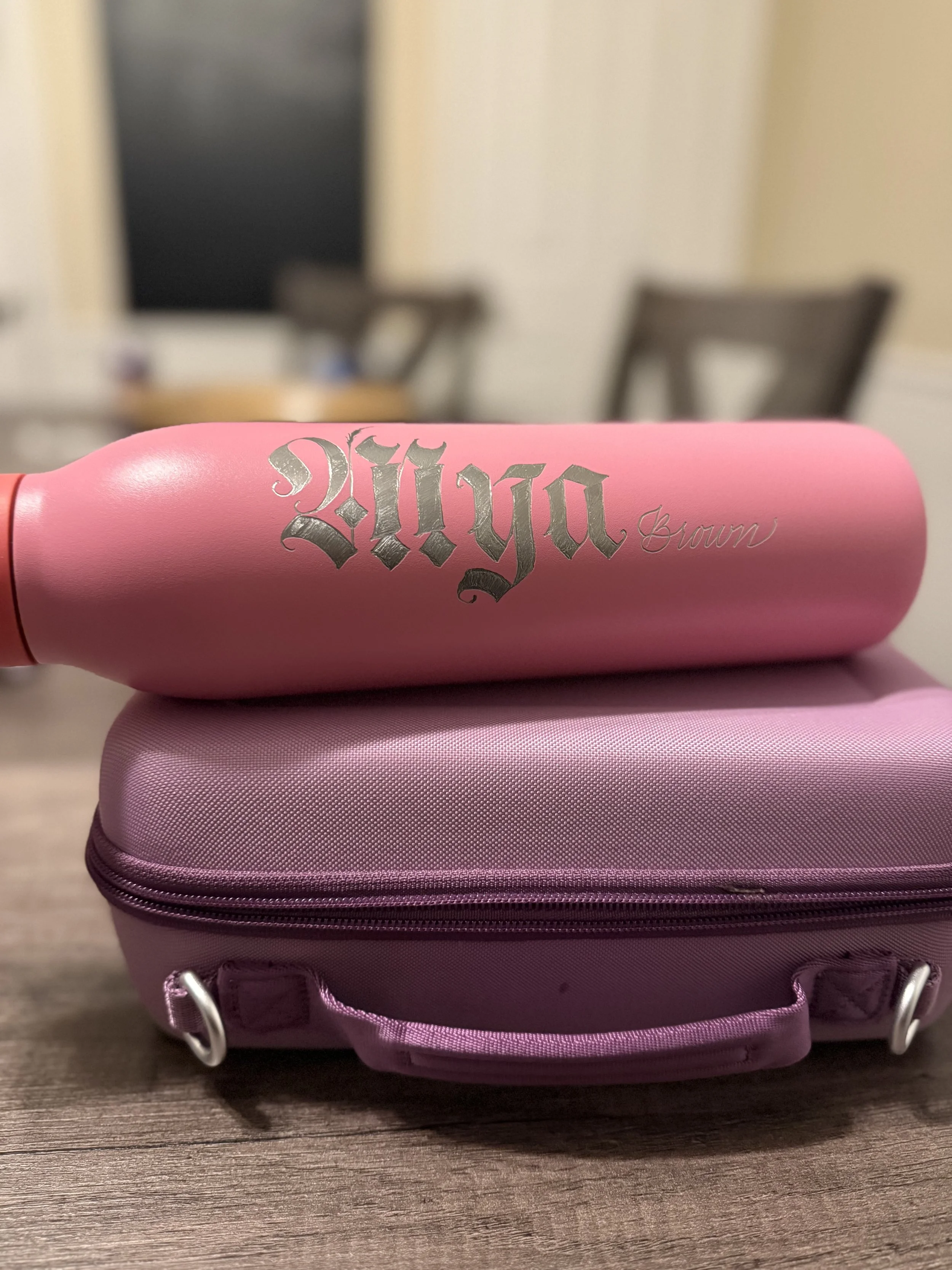 pink water bottle with the name mya engraved in fraktur