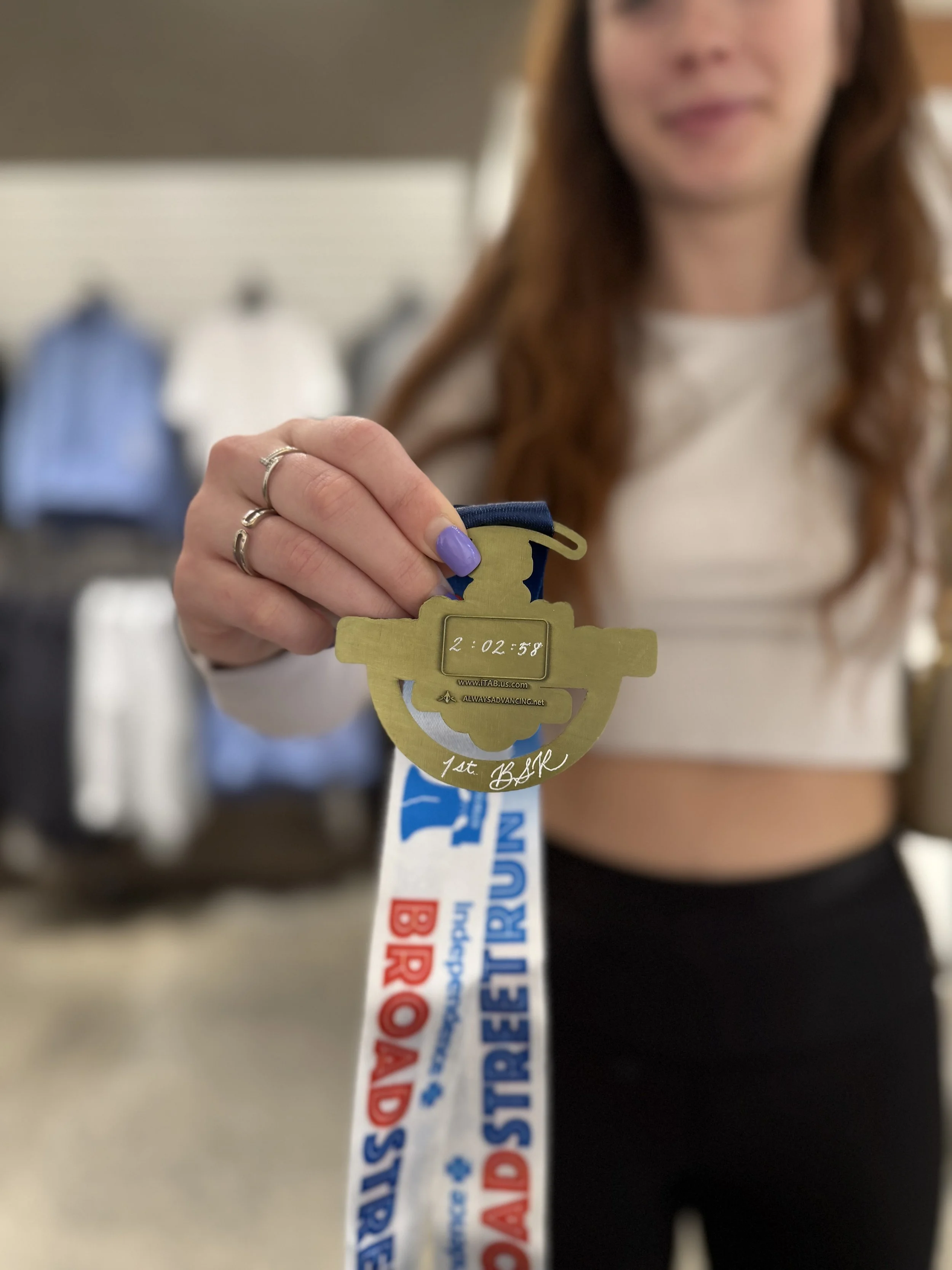 Lululemon Broad Street Run | One of two artists engraving medals celebrating participants and creating personalized keepsakes tied to a major personal achievement.