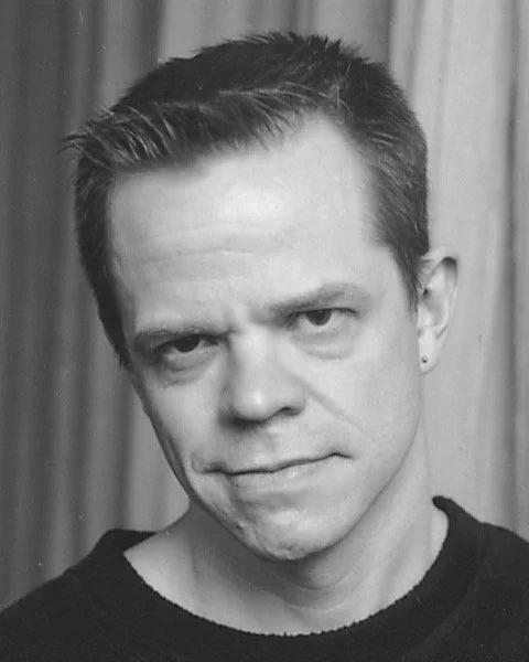 black sweatshirt headshot.jpeg