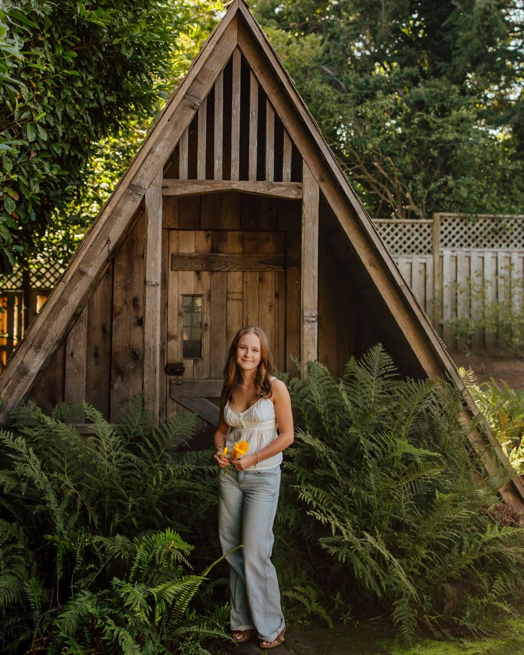 When I tell you my heart nearly exploded out of my chest when I saw this little A-Frame garden shed surrounded by fluffy ferns...I mean is that not the cutest ever?!? And then Caroline steps in front of the camera, with her mini neighborhood bouquet.