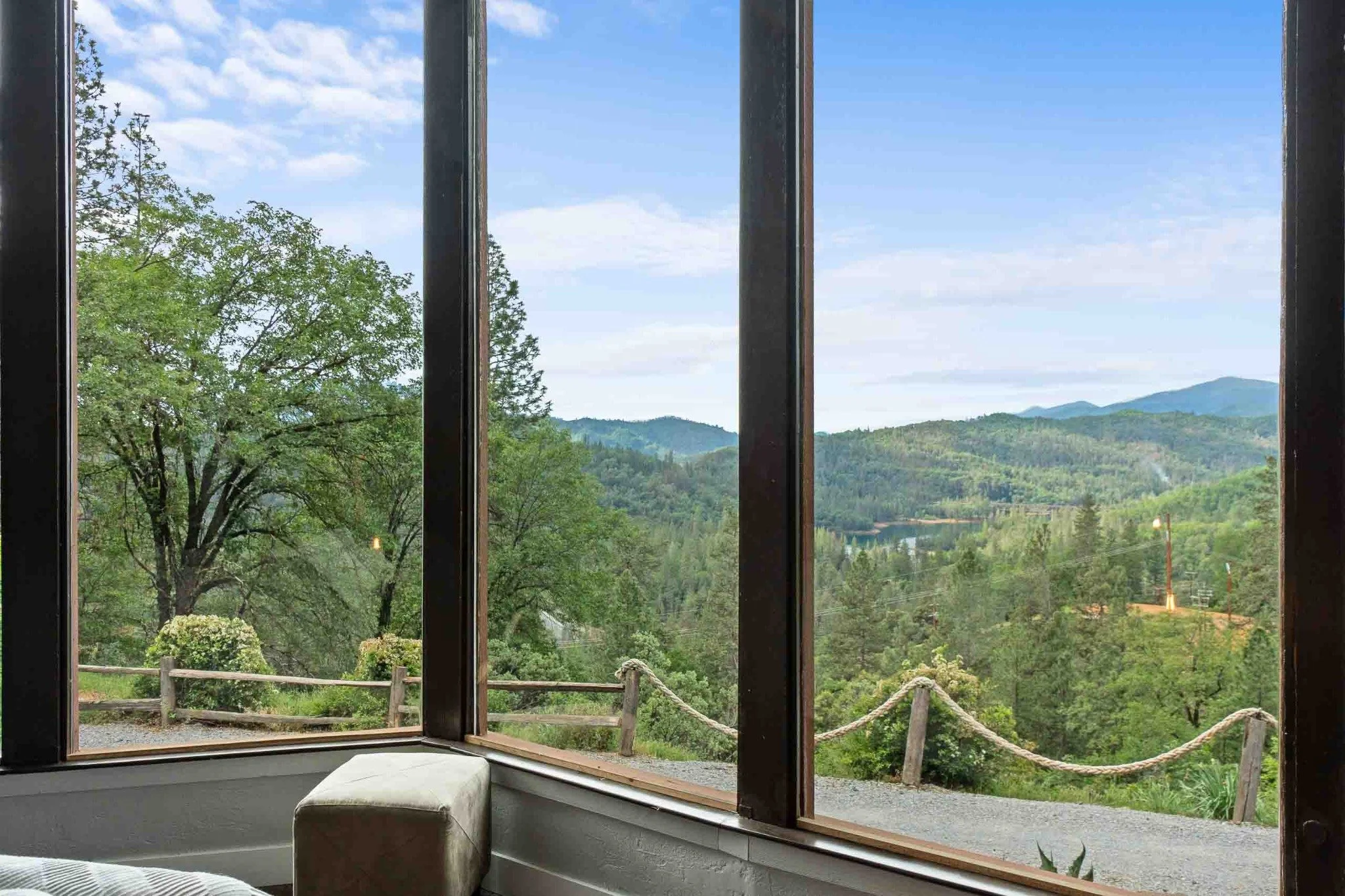 Mountain and lake views through large windows in a Northern California home.