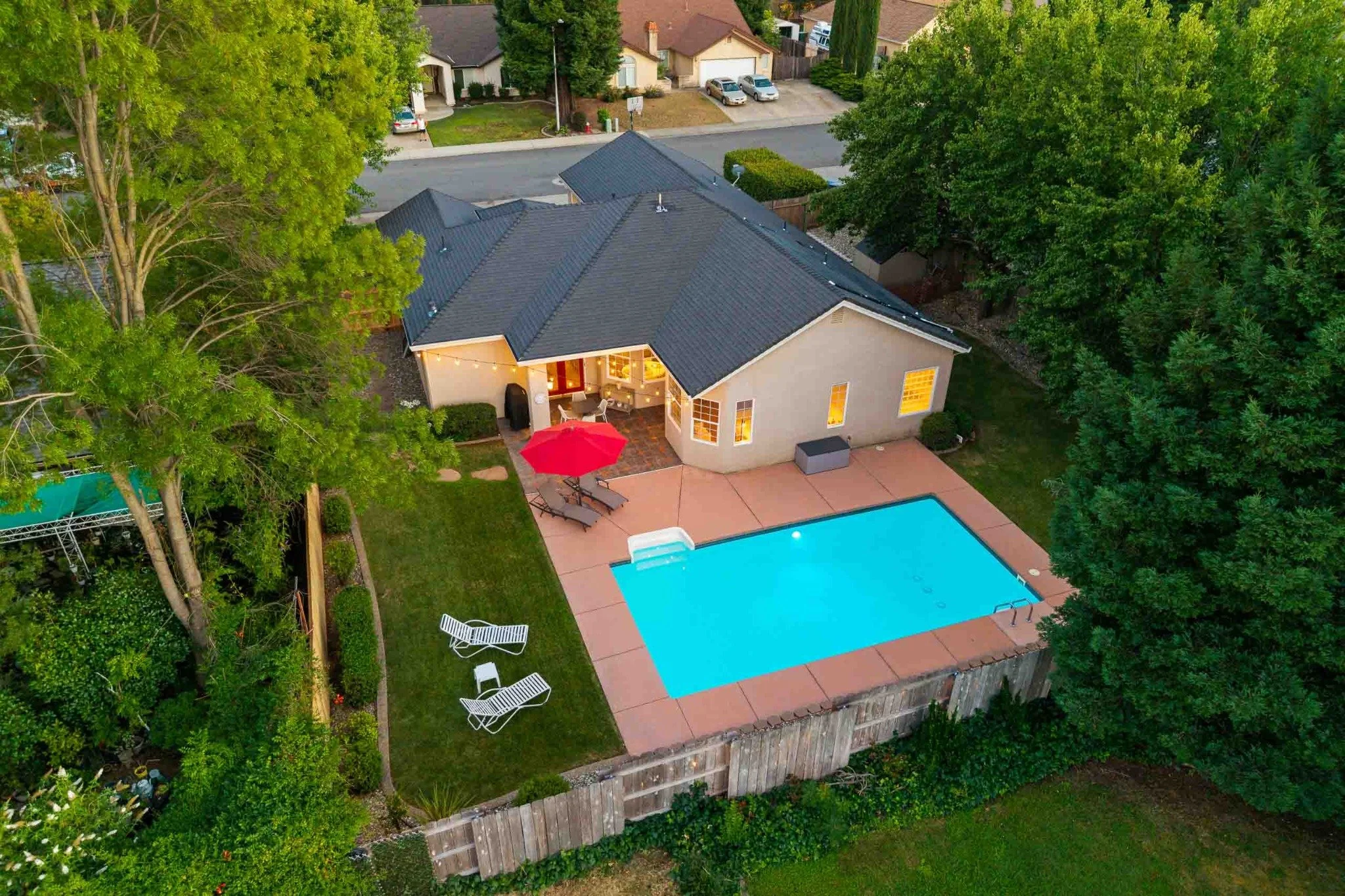 Aerial view of a Redding home with a rectangular backyard swimming pool.