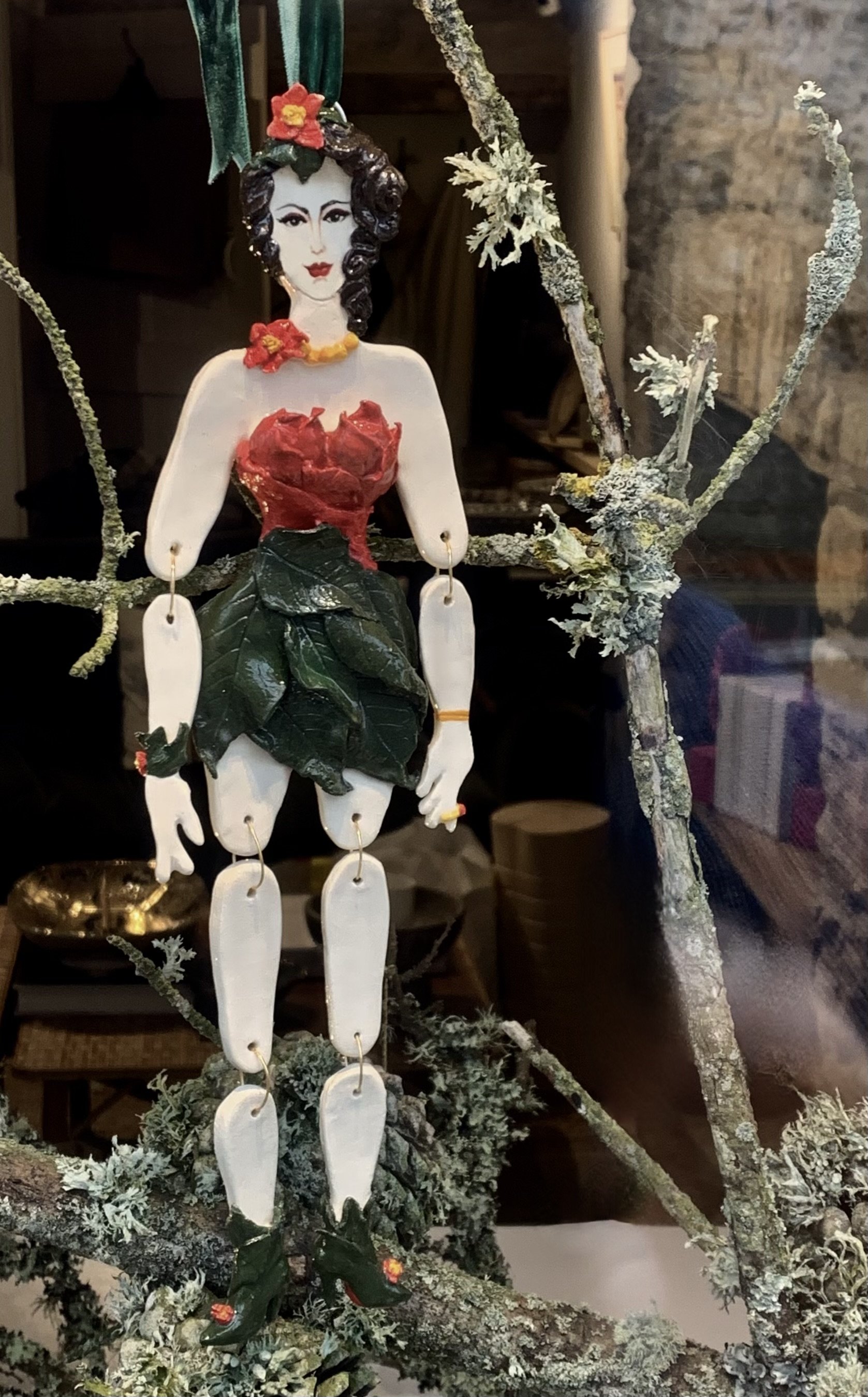 'Miss Plummy Poinsettia'
Cornish stoneware ceramic, sculpted and decorated by hand with leaves and poinsettia petals. 33cm tall.