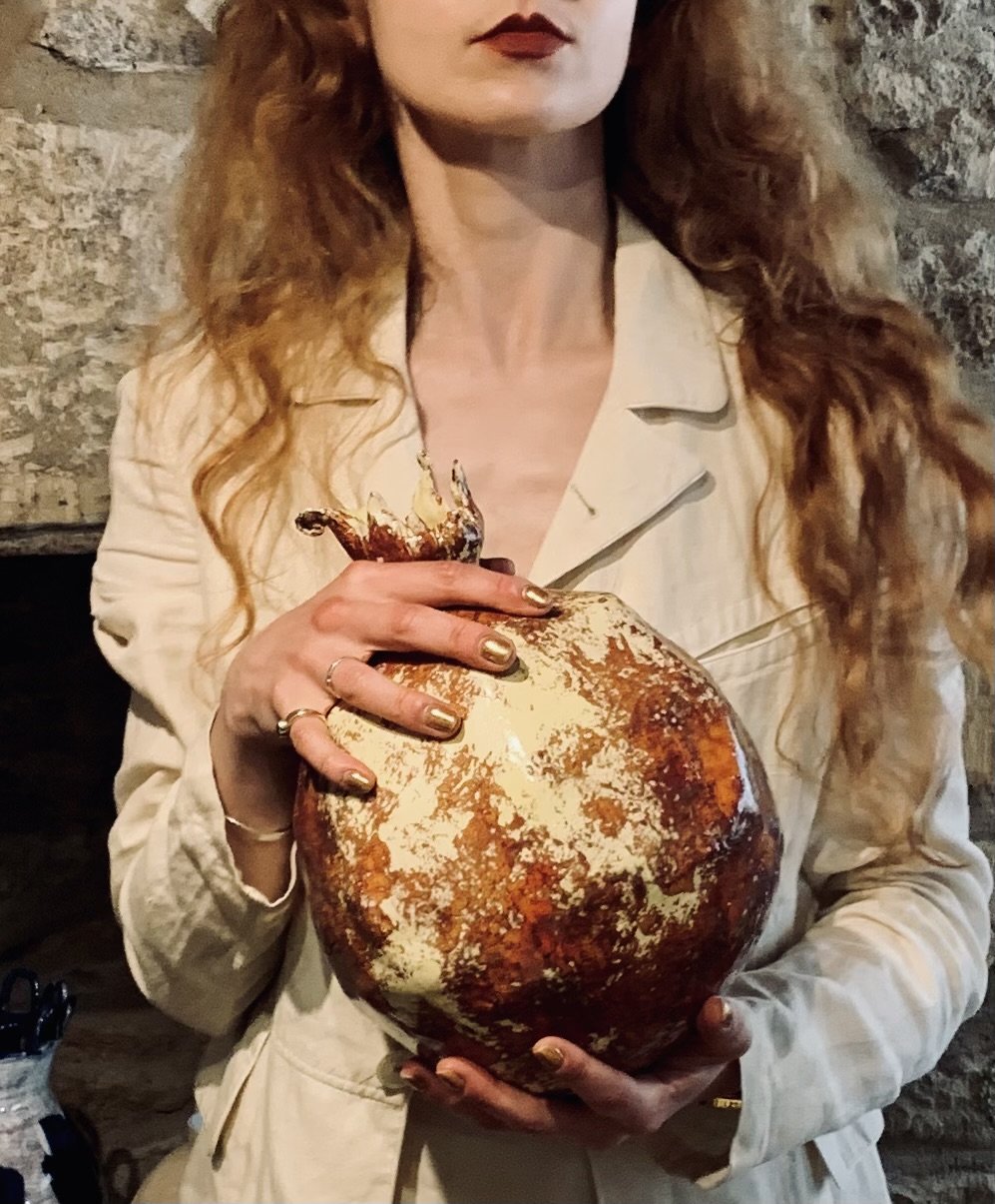 Colossus: larger than life sized pomegranate, hand sculpted and glazed.