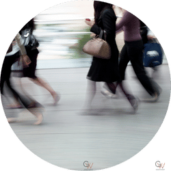 two people standing in front of a white board with sticky notes on it