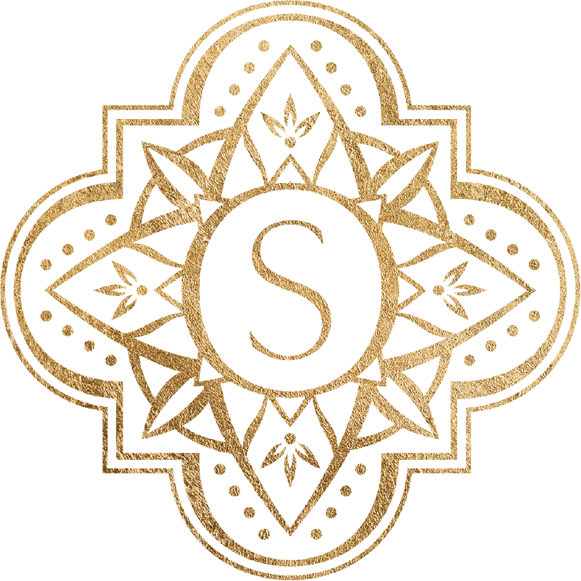 Gold ornate emblem with letter S at the center
