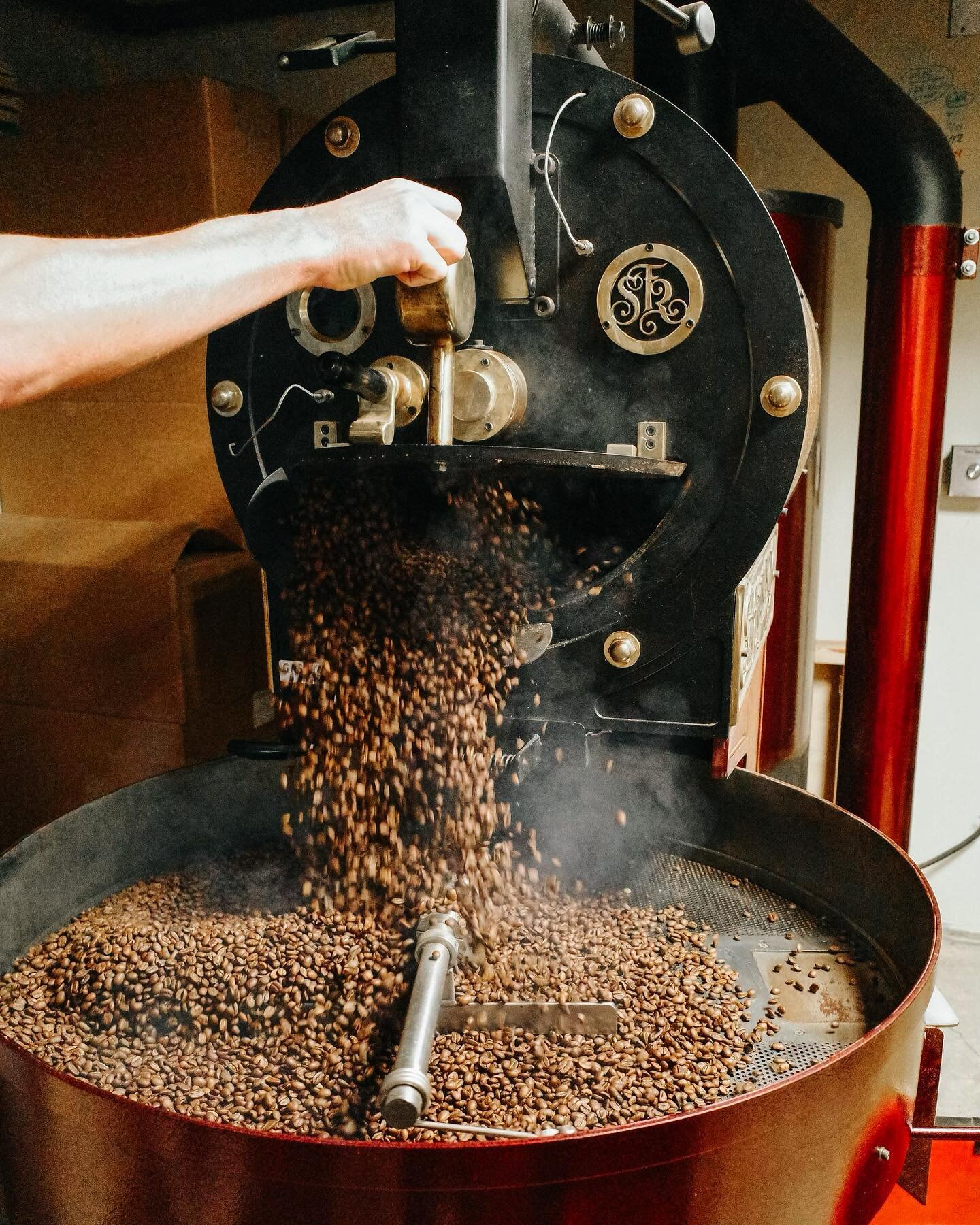 The machine behind the magic - our trusty coffee roaster. Turning green beans into vessels of flavor, one roast at a time!