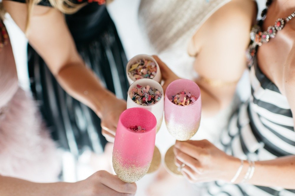 glittery glasses filled with colorful confetti