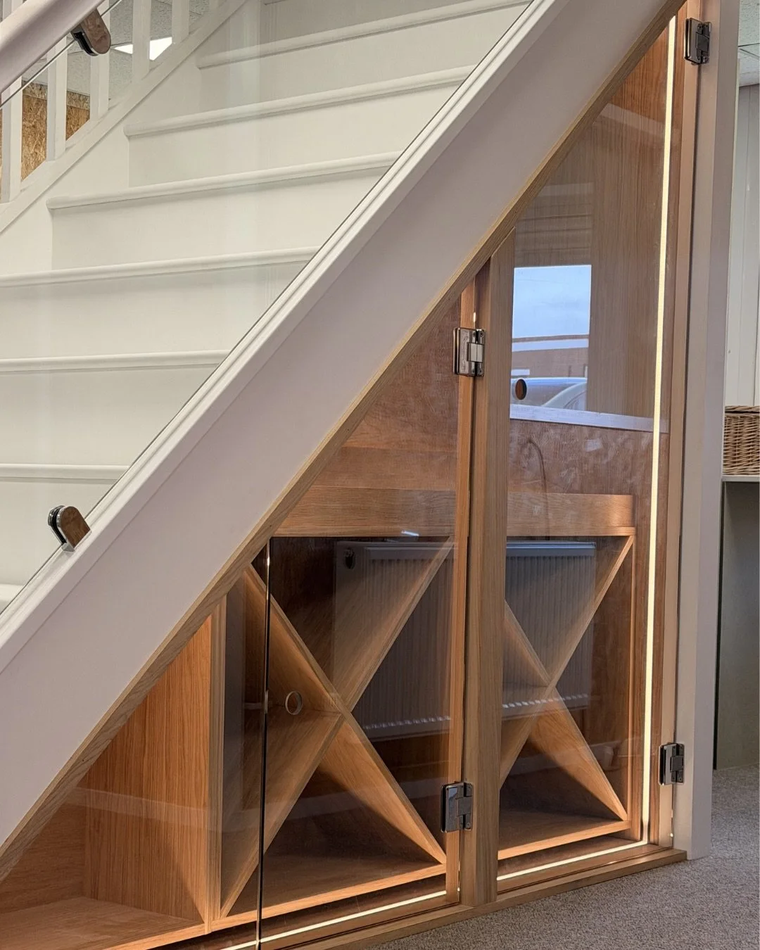 The space you forget about&hellip; done properly.

We turned this under-stairs area into bespoke wine storage that feels intentional, not hidden. Warm wood, soft lighting, and a place for everything 🍷

Proof that the most overlooked spaces can becom