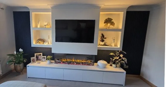 A well-designed media wall should do more than house a screen, it should elevate how a space functions and feels.

This recent installation combines integrated storage, architectural panelling, and layered lighting to create a seamless focal point wi