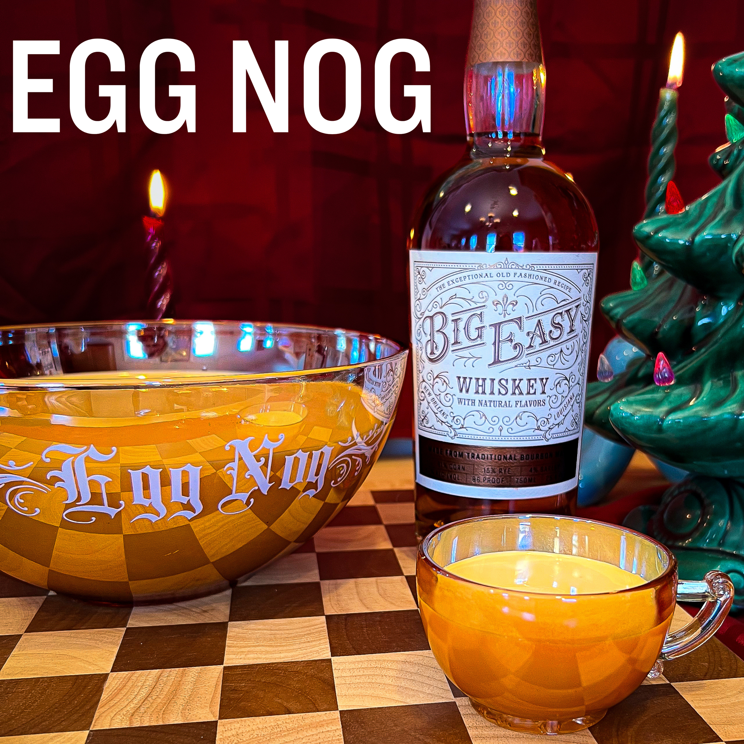 Holiday Egg Nog cocktail recipe tile featuring a bottle of Big Easy Whiskey, a vintage punch bowl, and a ceramic Christmas tree with bold text reading 'EGG NOG'.