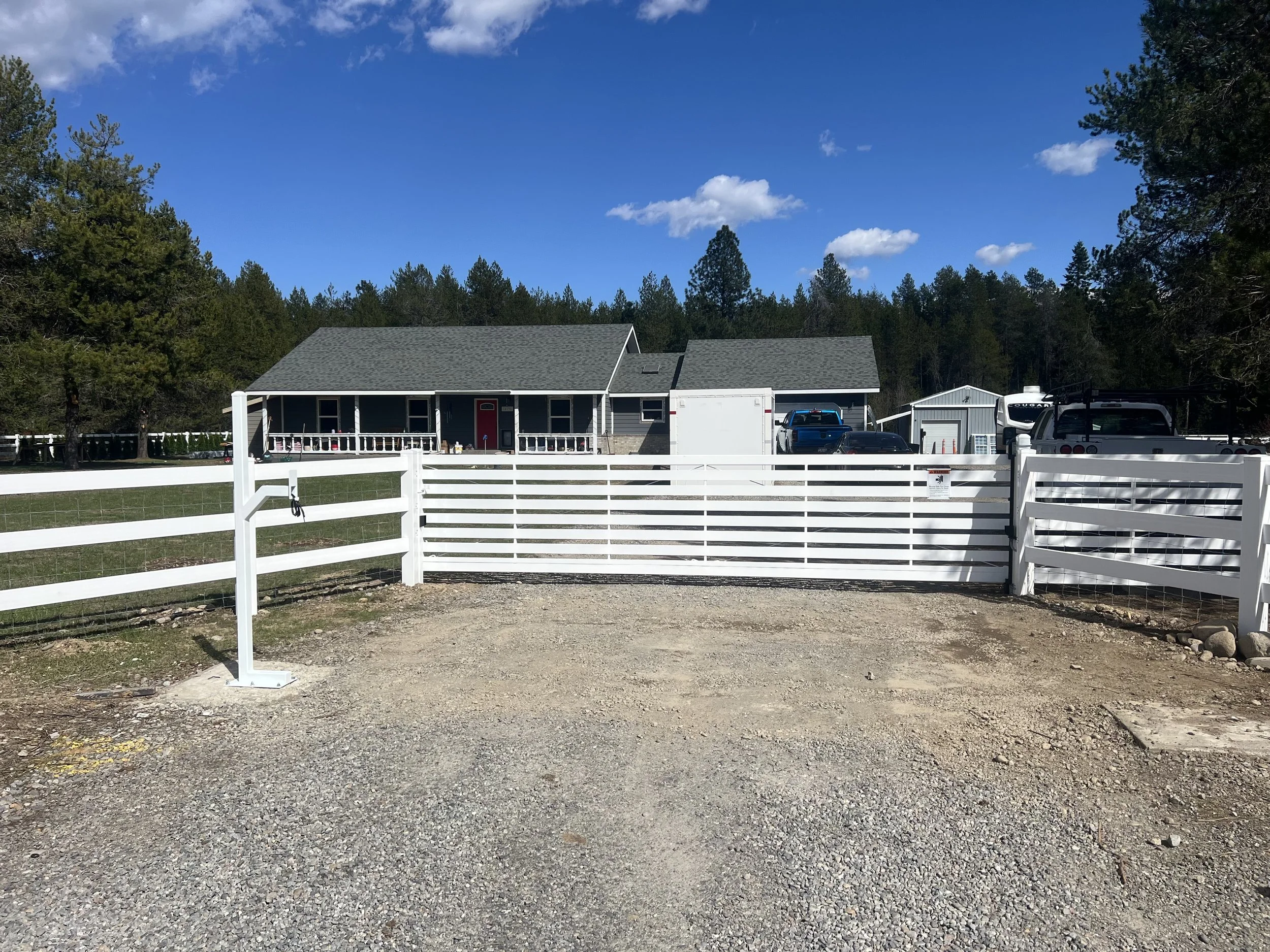 White Automated Gate and Keypad Entry with White Vinyl Rail Fencing