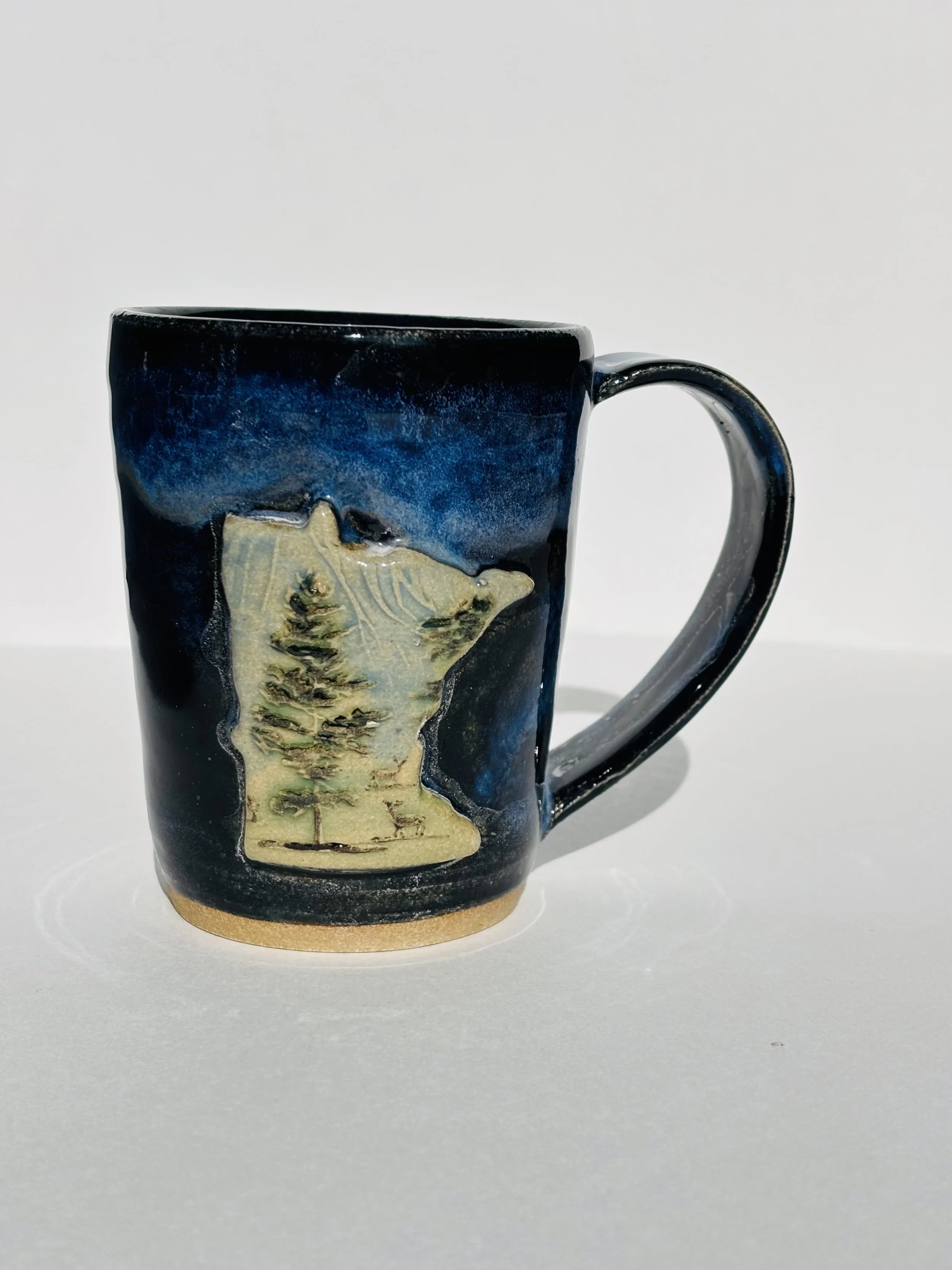 Obsidian and indigo float MN Mug.jpeg