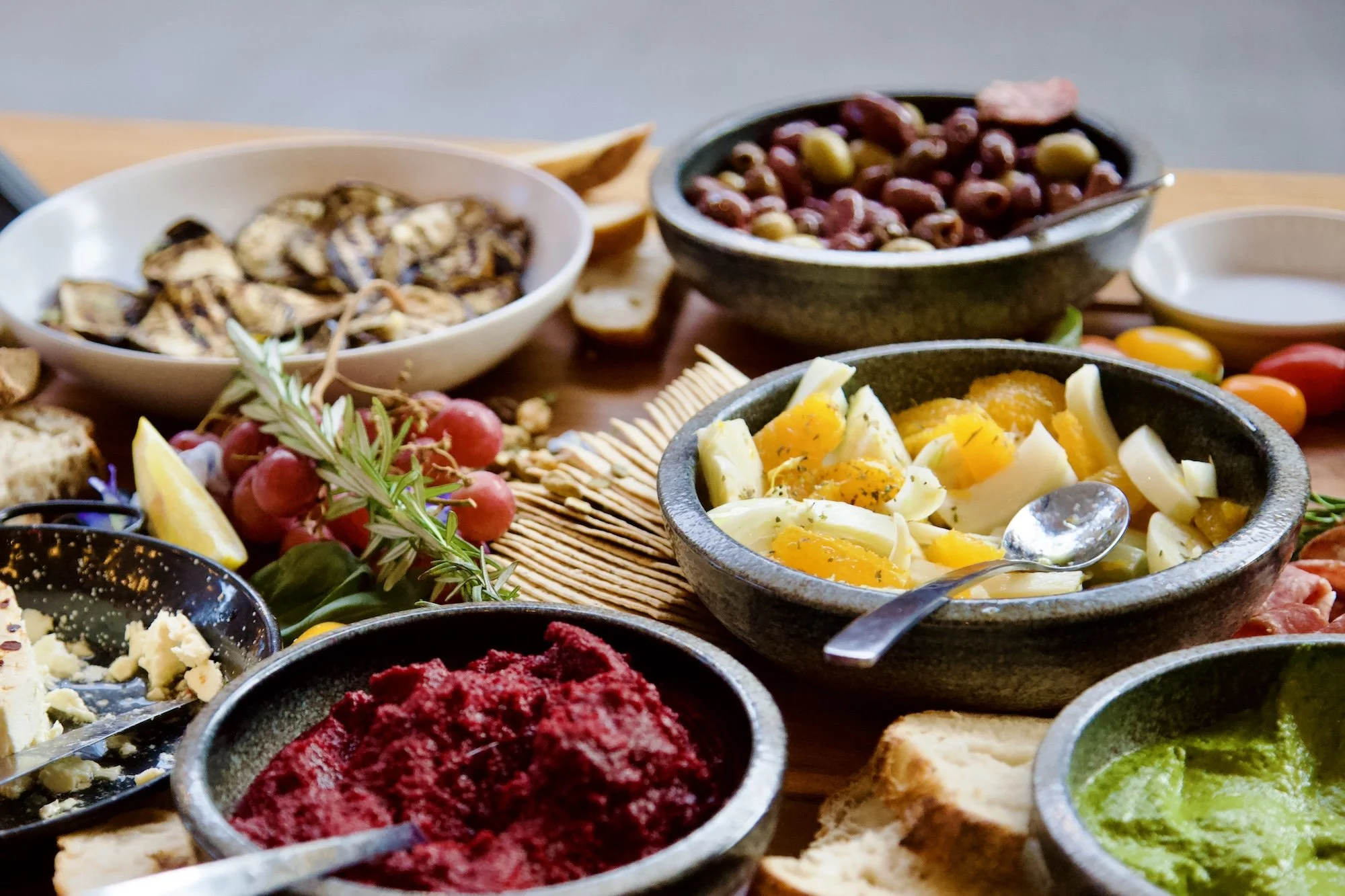 Gourmet grazing table at Paddock Bakery Geelong with dips, antipasto, fresh fruit, and artisan bread, ideal for brunches and milestone gatherings. 