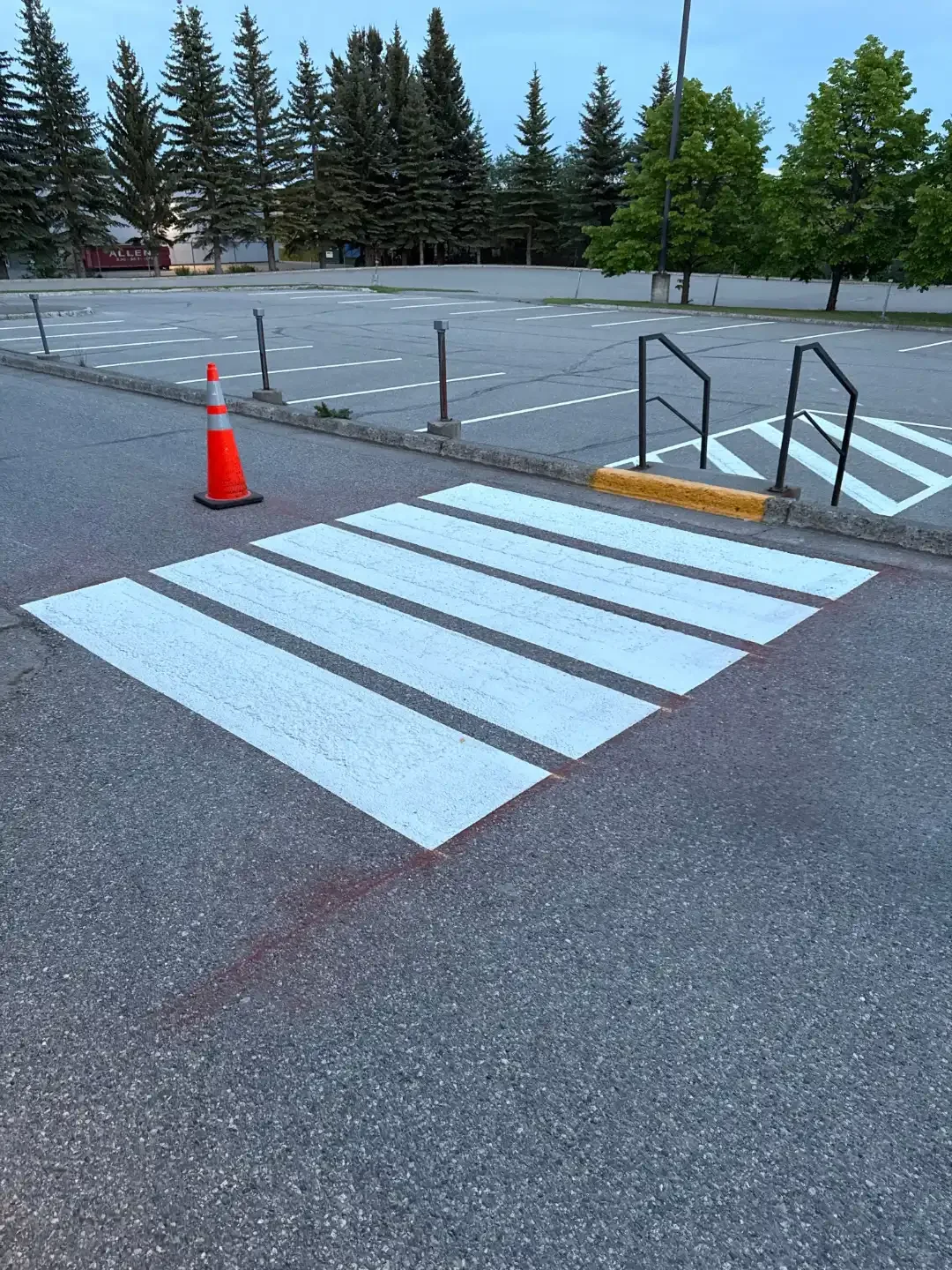 Fresh pedestrian crosswalk line painting in commercial parking lot - Epic Pavement