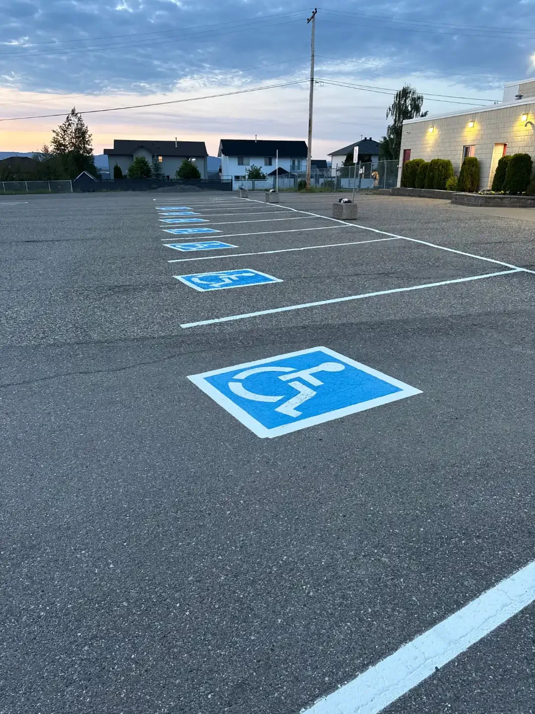 Parking lot line painting for accessible parking spaces at commercial property - Epic Pavement