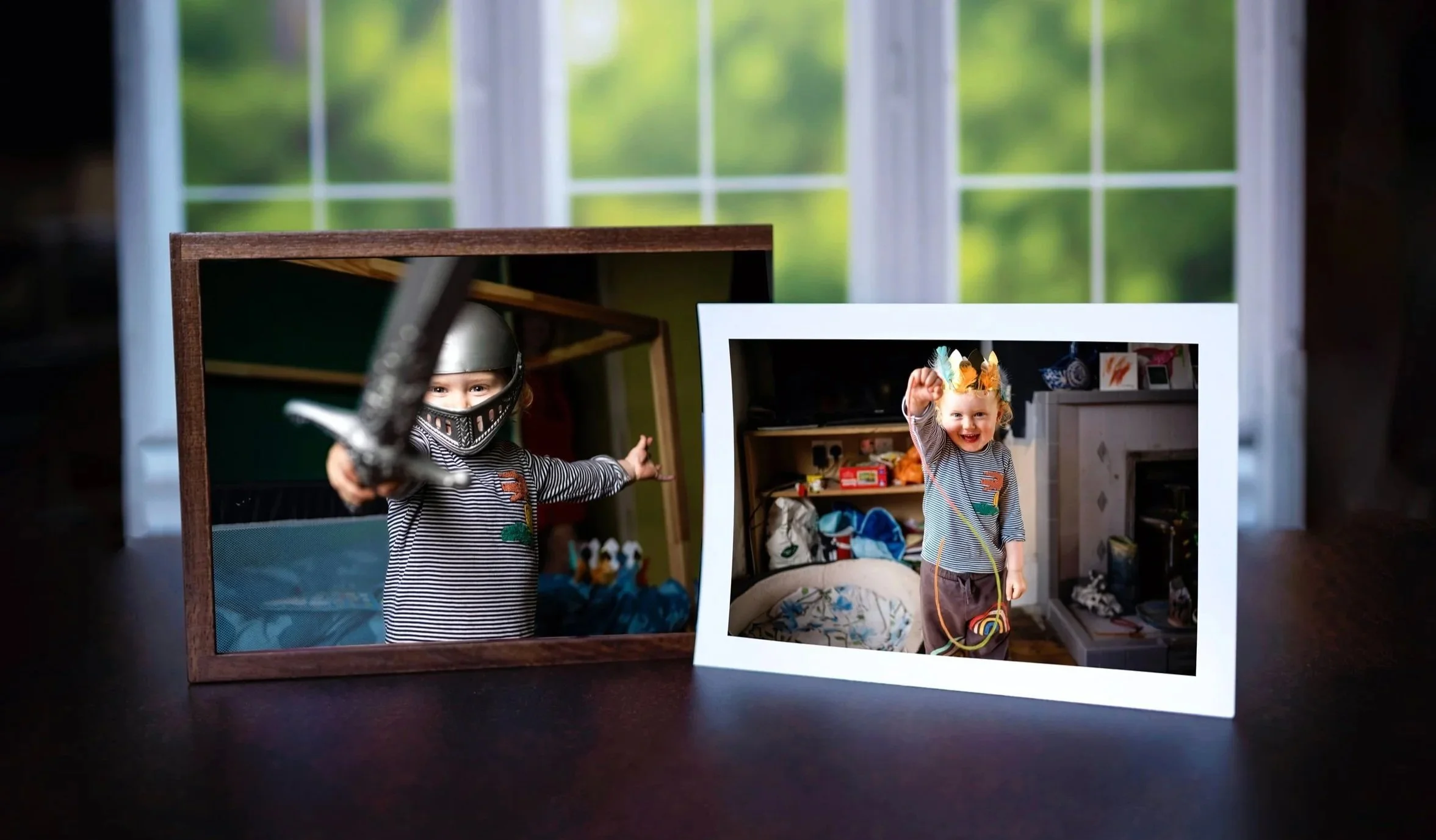 A photograph of a little red-haired 3-year-old boy holding a sword and the other photo next to it he's holding a jump rope and wearing a party hat