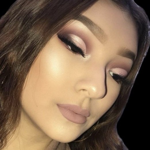 Close-up of a woman's face with makeup, including eyeshadow, eyeliner, mascara, and nude lipstick.