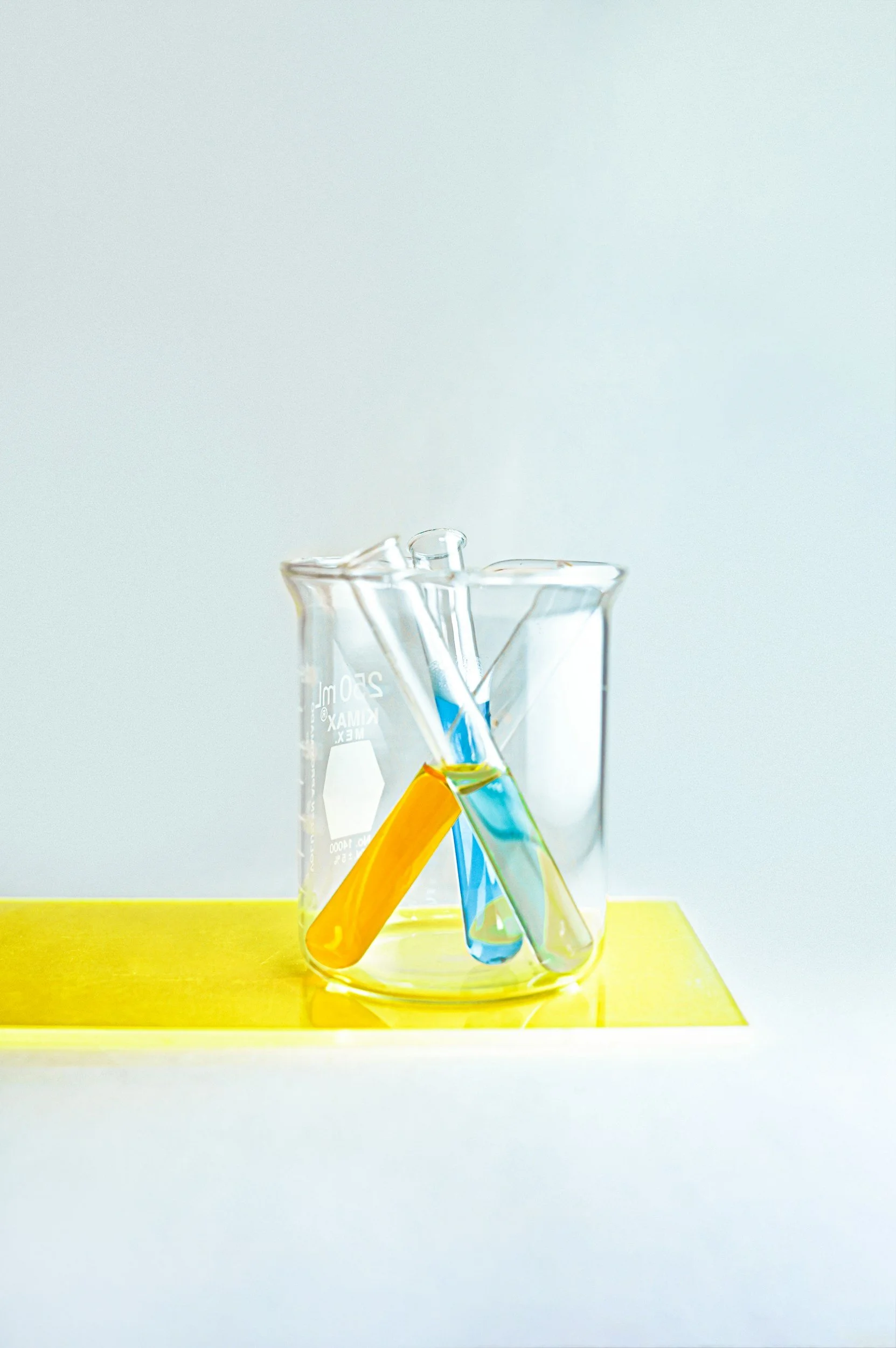 Laboratory beaker representing functional medicine testing used by naturopath Jessica Diakoumakos at Emba Wellness