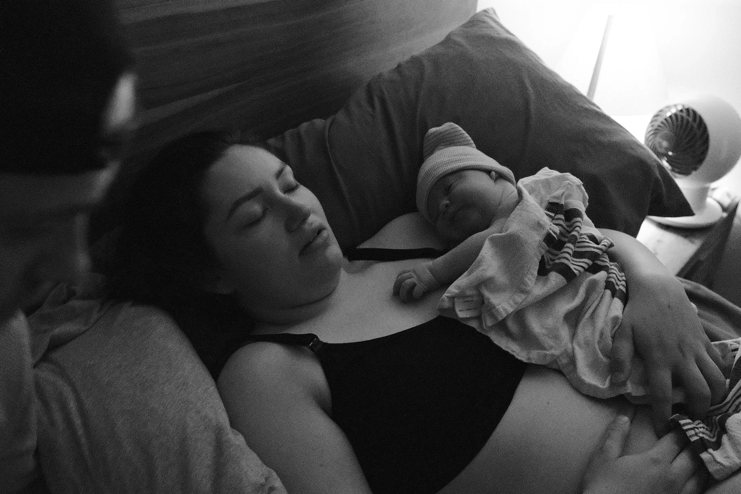 Newborn baby resting on mother's chest after delivery supported by Mindful Sprouts Toronto birth doula services.