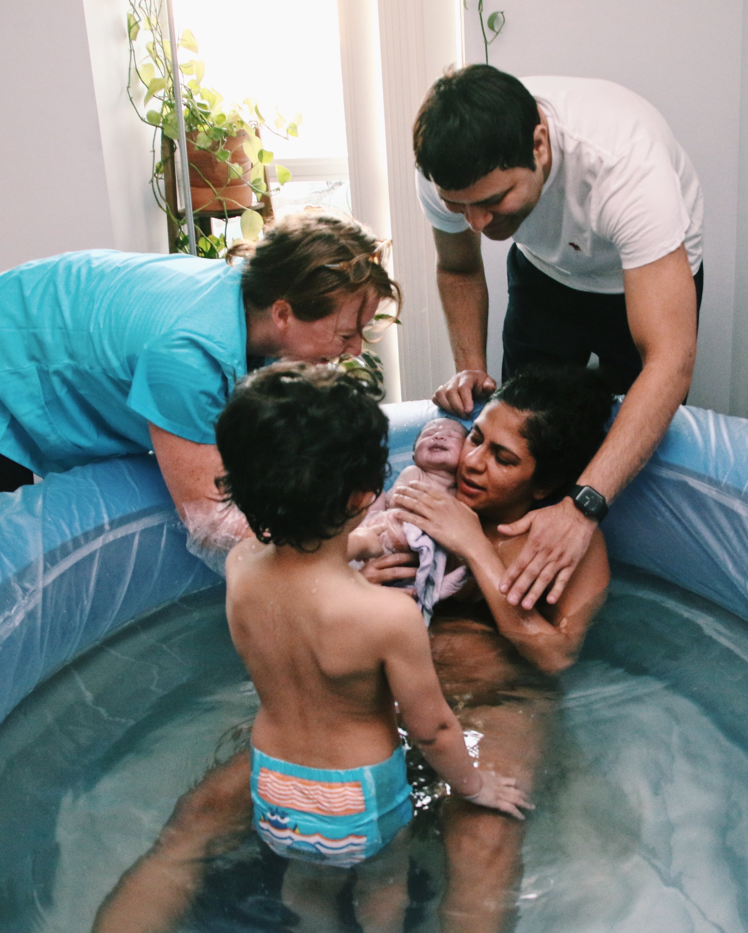 Toronto midwife catches baby at home waterbirth in Toronto home