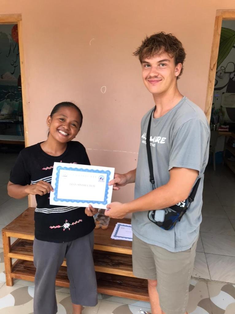 Miss Dian receiving her water safety certificate