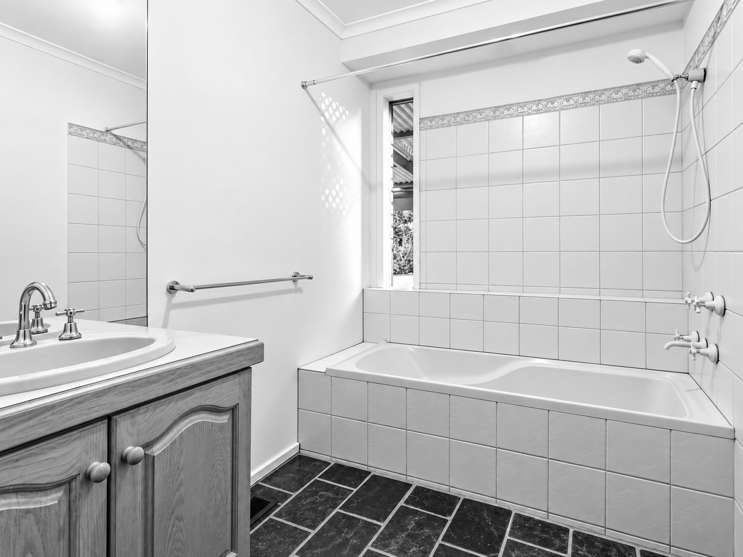Pool House bathroom before the renovation: shower over bath and vanity, by FTLO Design