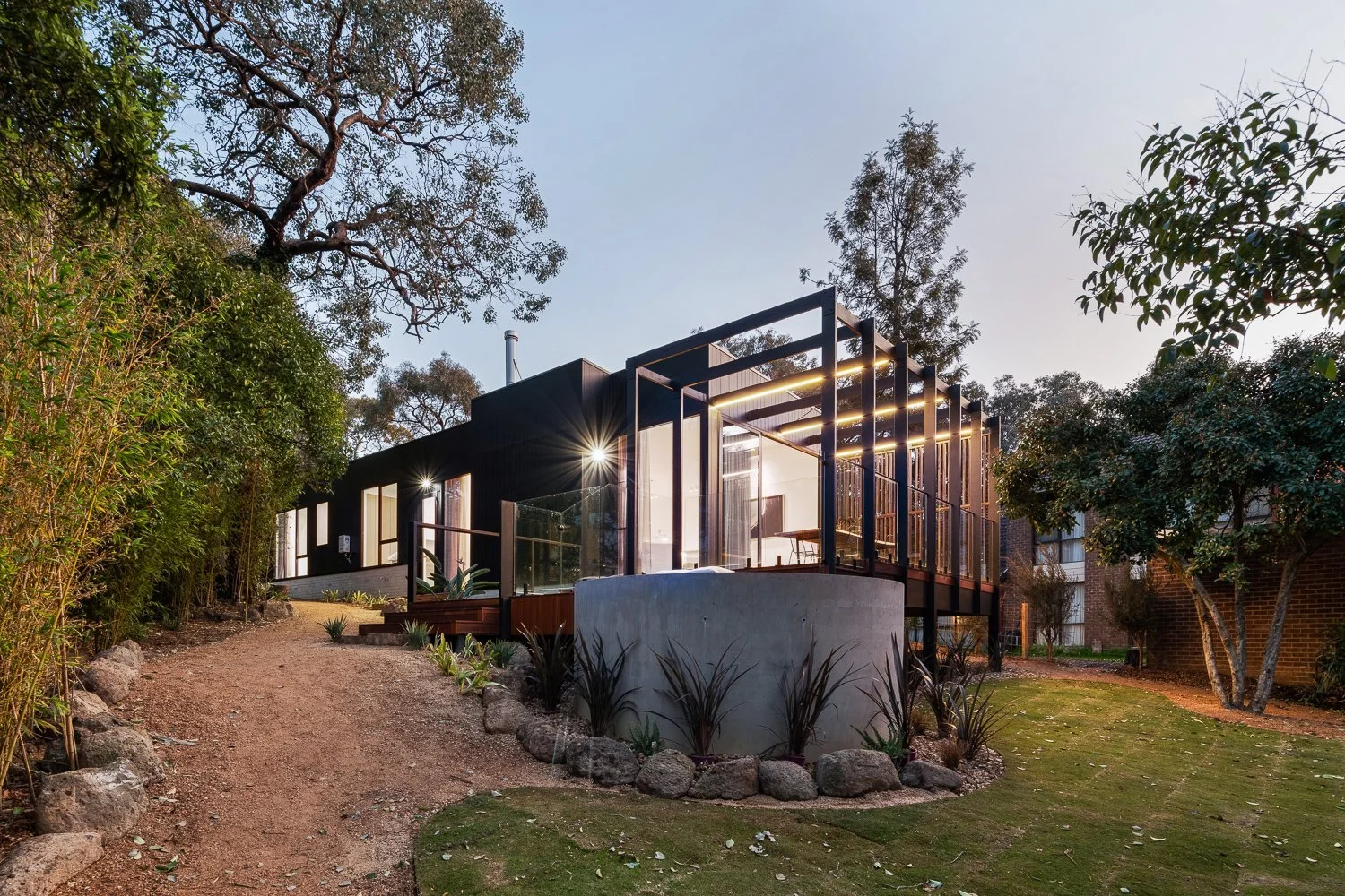 Japandi House garden path leading to the timber-screened entry, by FTLO Design