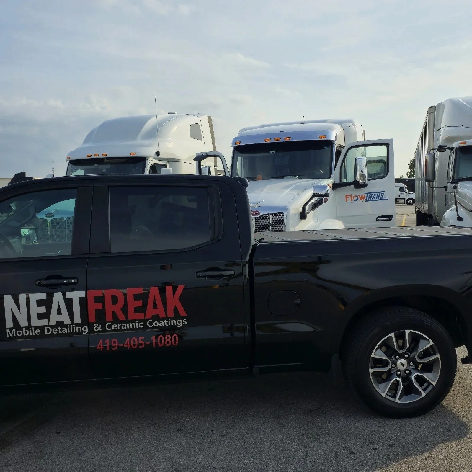 Neat Freak service truck in front of semi truck, getting ready to detail.