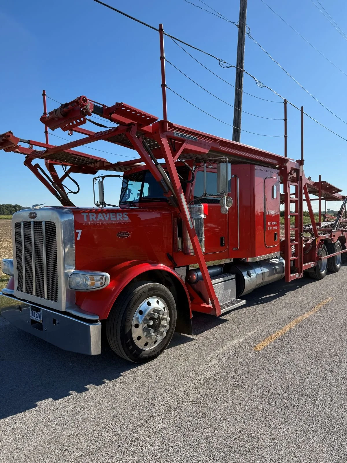 Red Peterbilt car hauler freshly detailed.