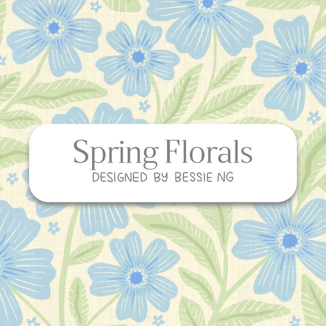 A pattern background trailing blue florals with green leaves and vines on a cream background. White rectangle at the centre with text saying “Spring Florals, designed by Bessie Ng"