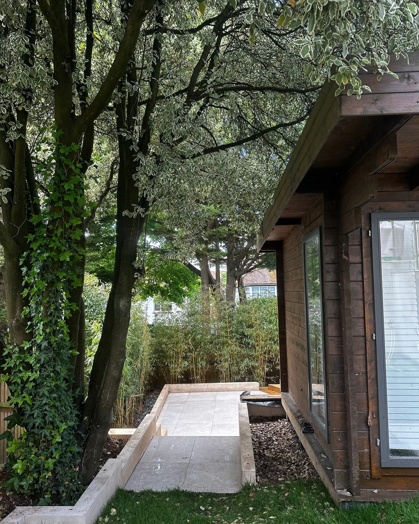 We designed this outdoor space to complement the multi-level garden, installing a deck with batten screening and patio to enhance outdoor living &amp; social events. Closer to the house, soft grass offers a perfect play area for the kids. This stylis