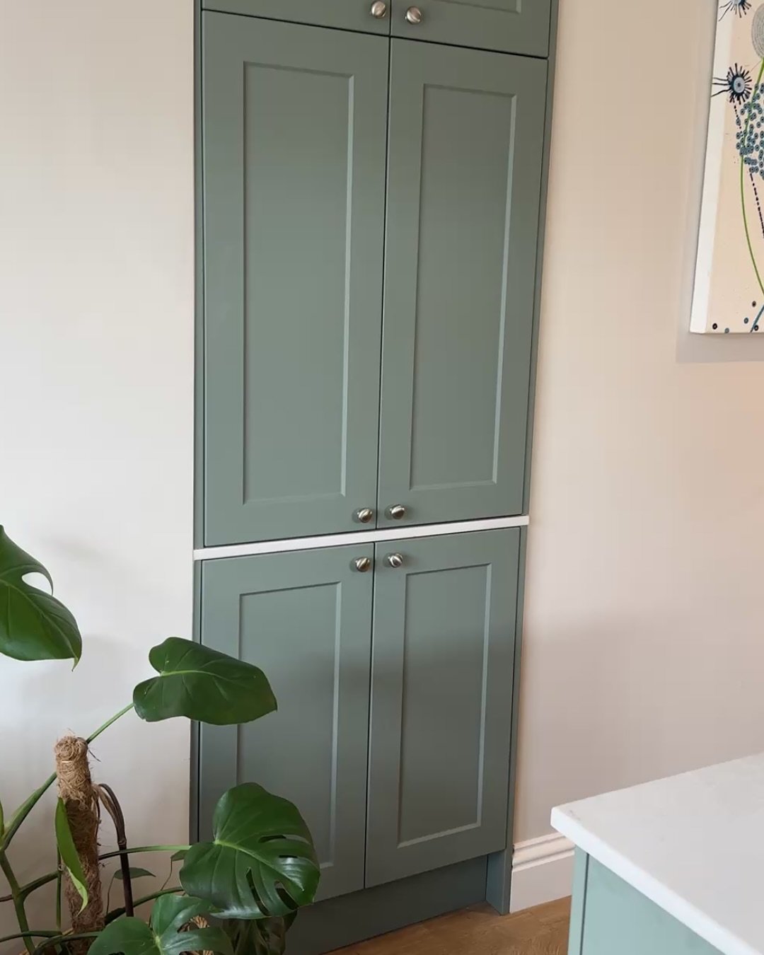 This alcove cabinet was built to house small appliances in a clean, practical way. A Web Bespoke carcass was combined with Wren OEM doors to match the kitchen. 

A quartz surface ties in with the rest of the space, and integrated sockets keep everyth