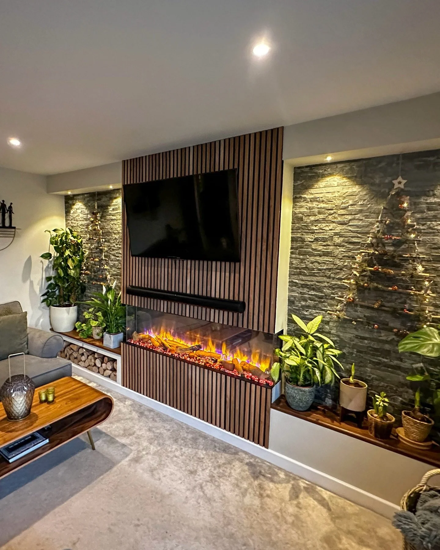 A considered design brought together with warm textures, clean lines and practical details. This media wall blends storage, feature lighting and an inset fire to create a focal point that works just as well day-to-day as it does through the colder mo