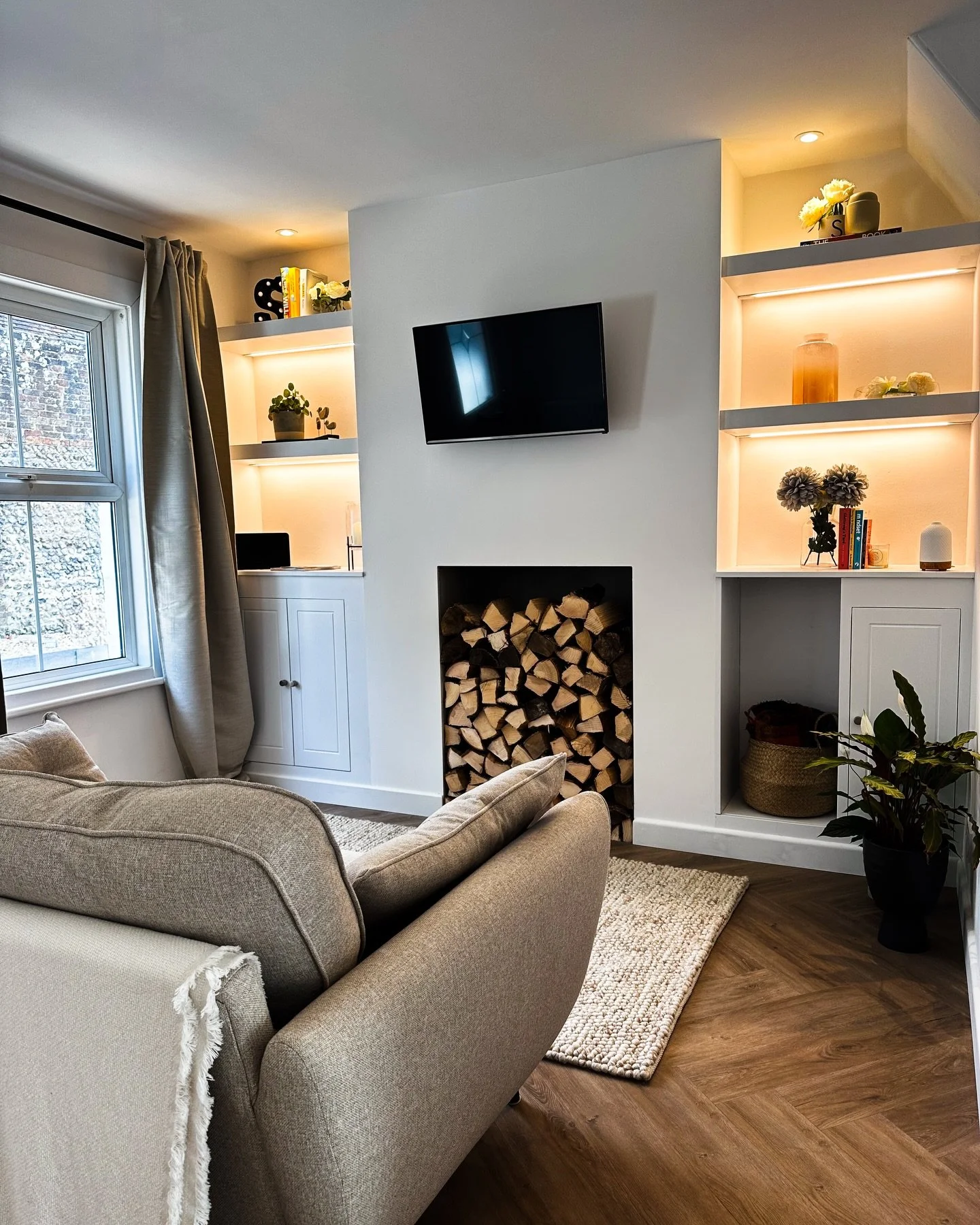 In this cottage renovation we worked with the original features. The fireplace was carefully restored, we added bespoke alcove storage and new flooring to support everyday use.