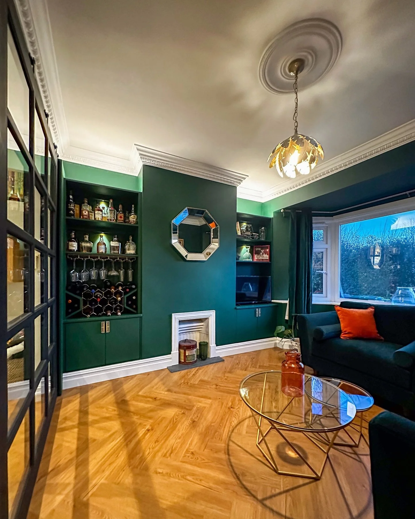 Tom and Leslie wanted this to feel less like another television room and more like a relaxed whisky lounge. Somewhere calmer and slightly removed from the playroom and kitchen, but still connected when they have guests.

Almost everything in this roo