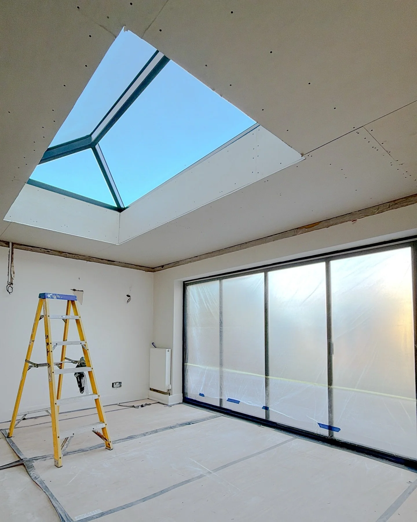 This project with Mia and Johnny has evolved in stages.

It began with this roof lantern. The room had good proportions but lacked natural light, so we opened the roof and installed a lantern that now pulls daylight deep into the space. What you see 