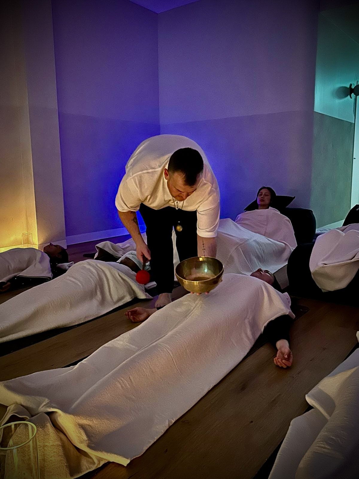 cott facilitating a group sound bath immersion using Shamanic sound and Reiki for nervous system regulation.