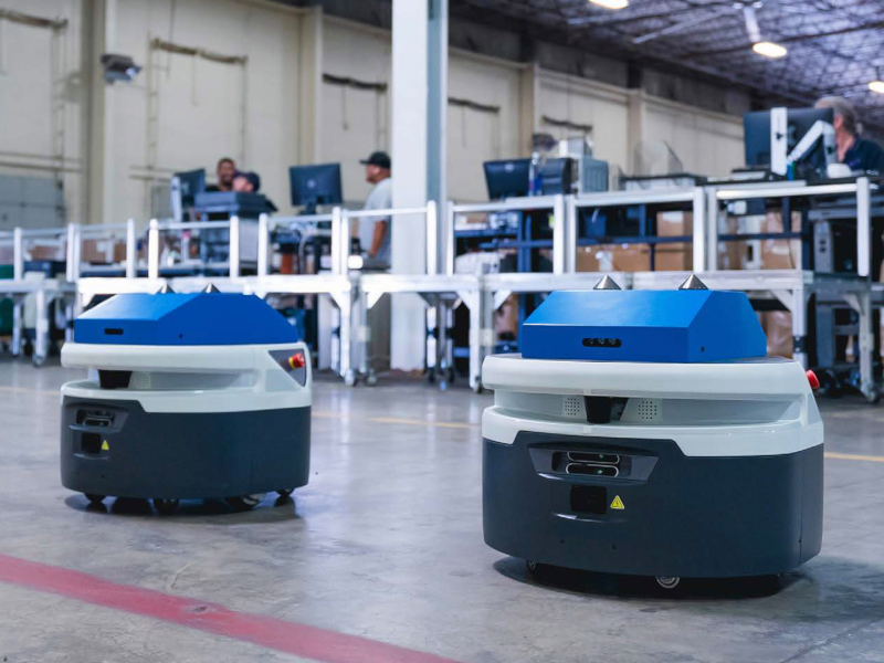 two zebra autonomous mobile robots in a smart warehouse