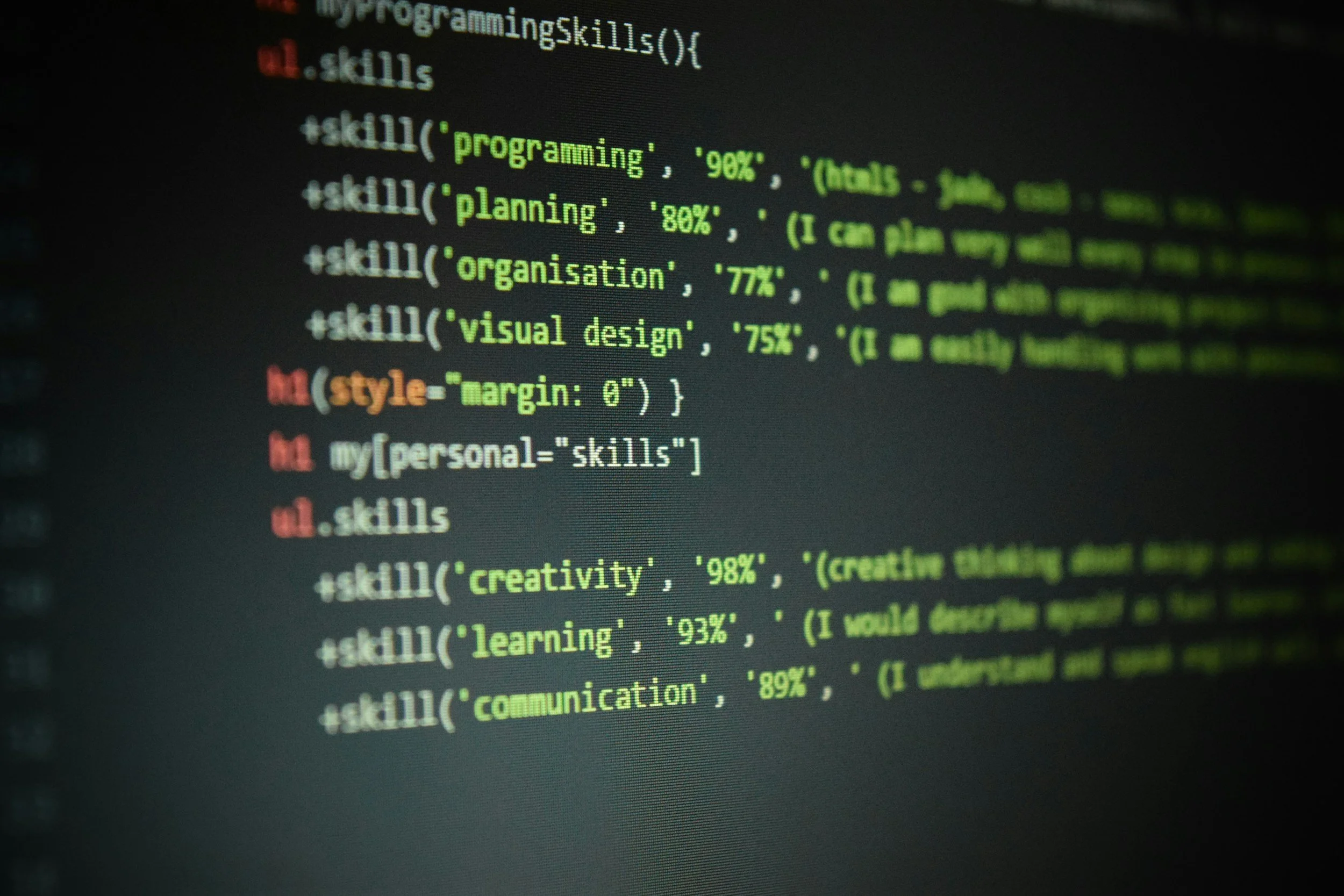 Computer code on a screen with colorful syntax highlighting for skills like programming, planning, organization, visual design, creativity, learning, and communication.