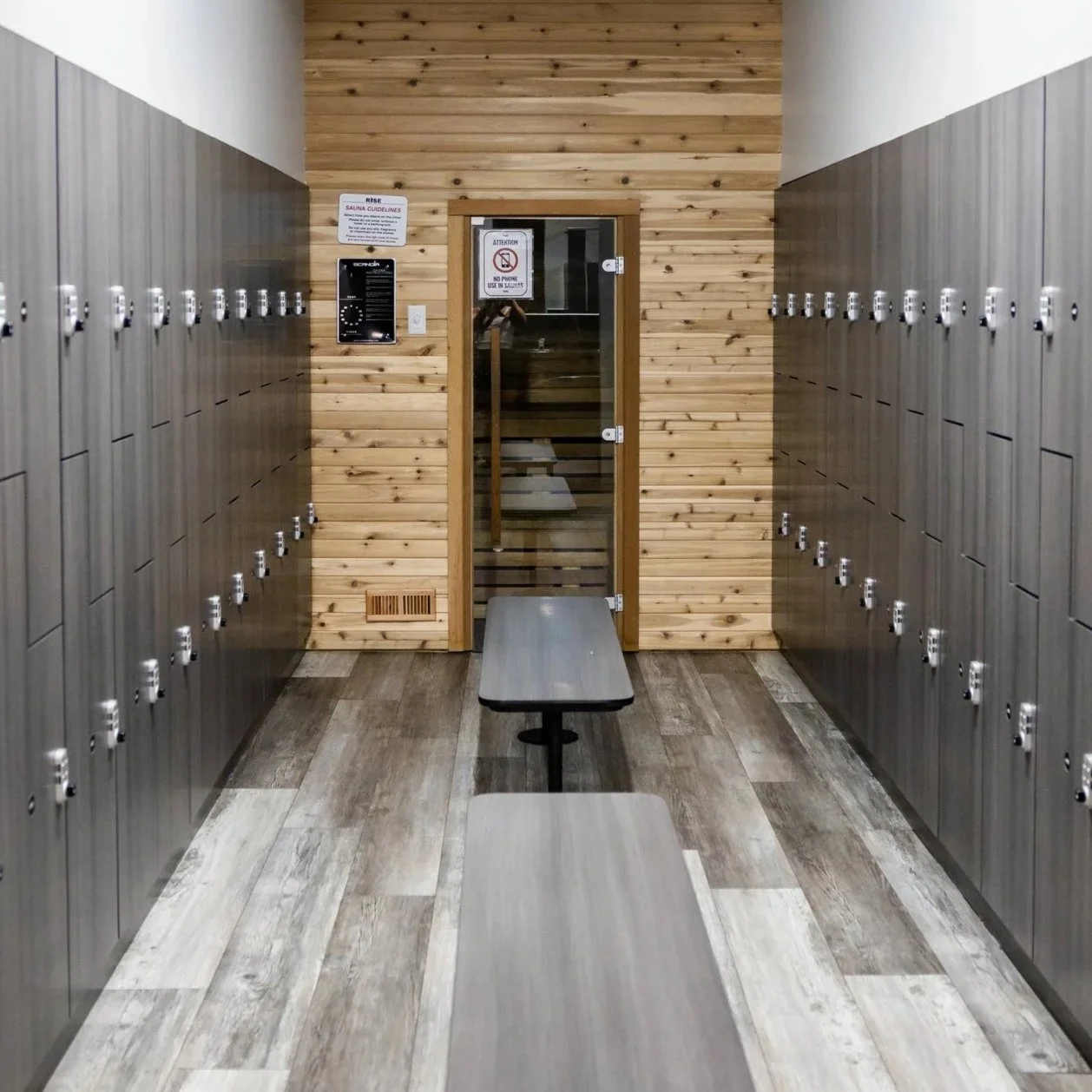 A vending machine stocked with various canned drinks, illuminated with bright white LED lights.