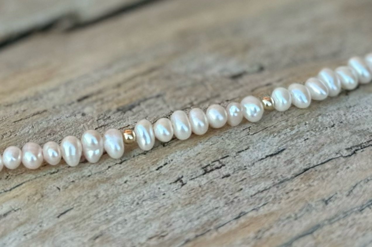 OLIVIA FRESHWATER POTATO PEARL BEADED NECKLACE ON WOOD.jpeg