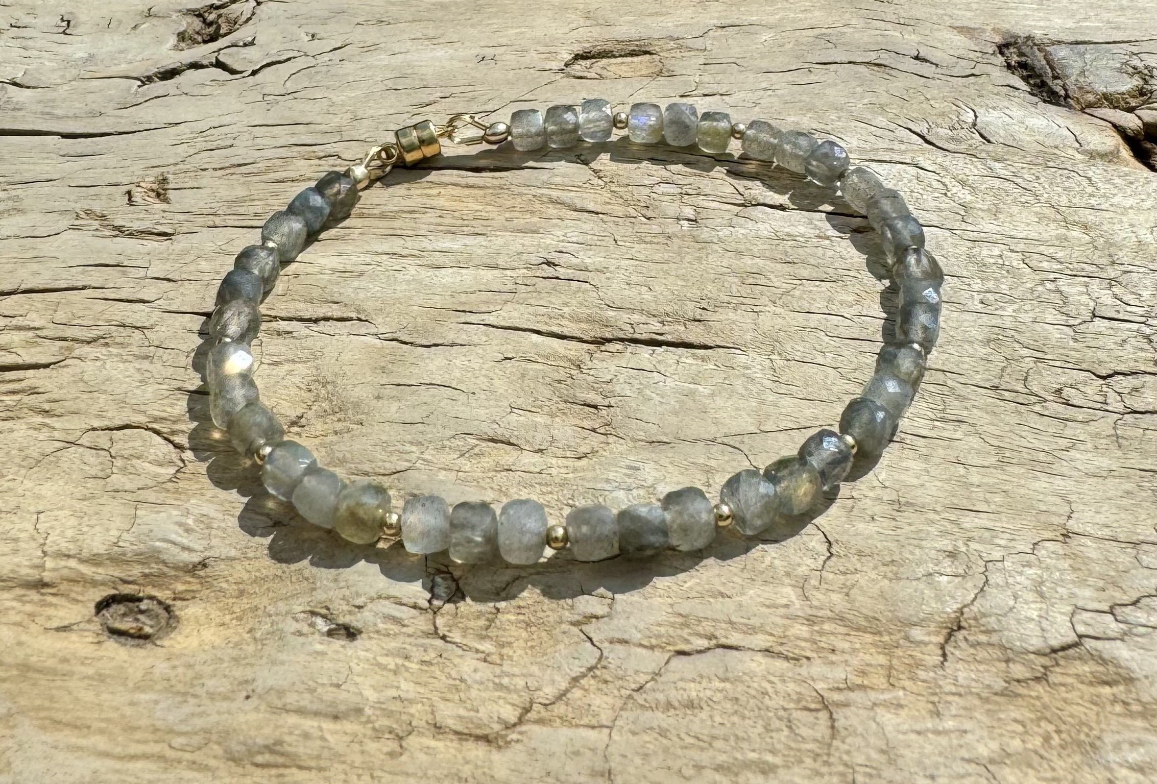 Kate Labradorite Faceted Cube Toggle Bracelet on Wood Top View.jpeg