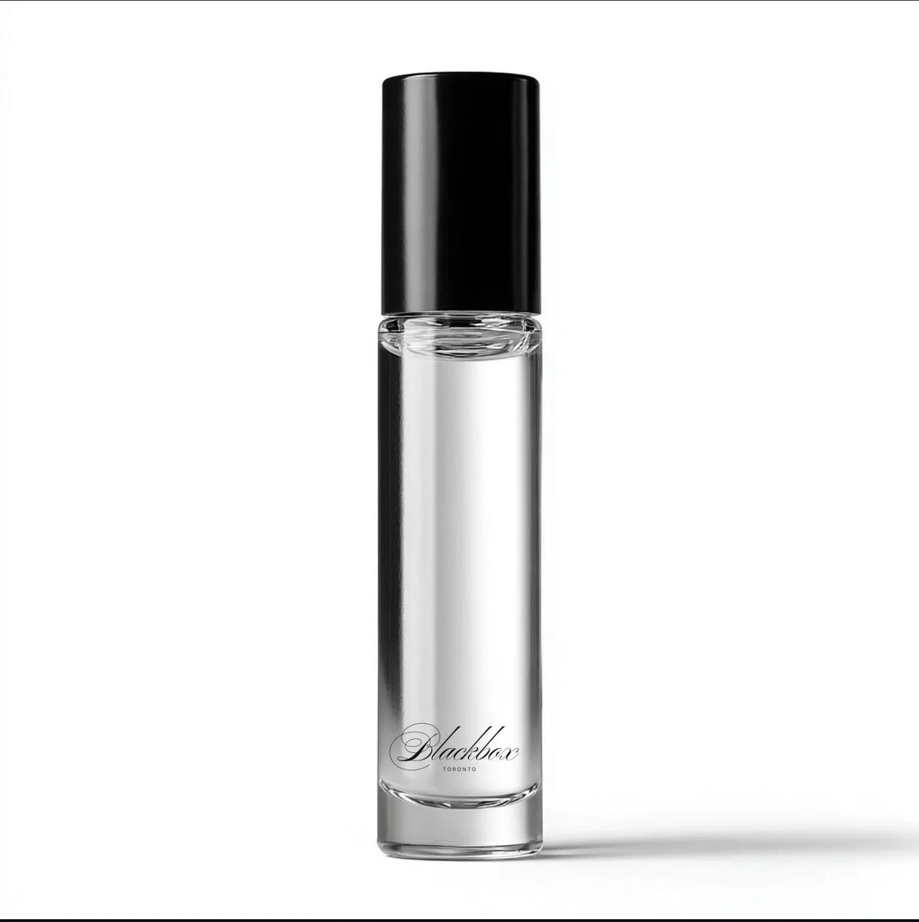 A clear perfume bottle with a black cap and elegant script text reading "Blackbox Toronto" on the front against a white background.