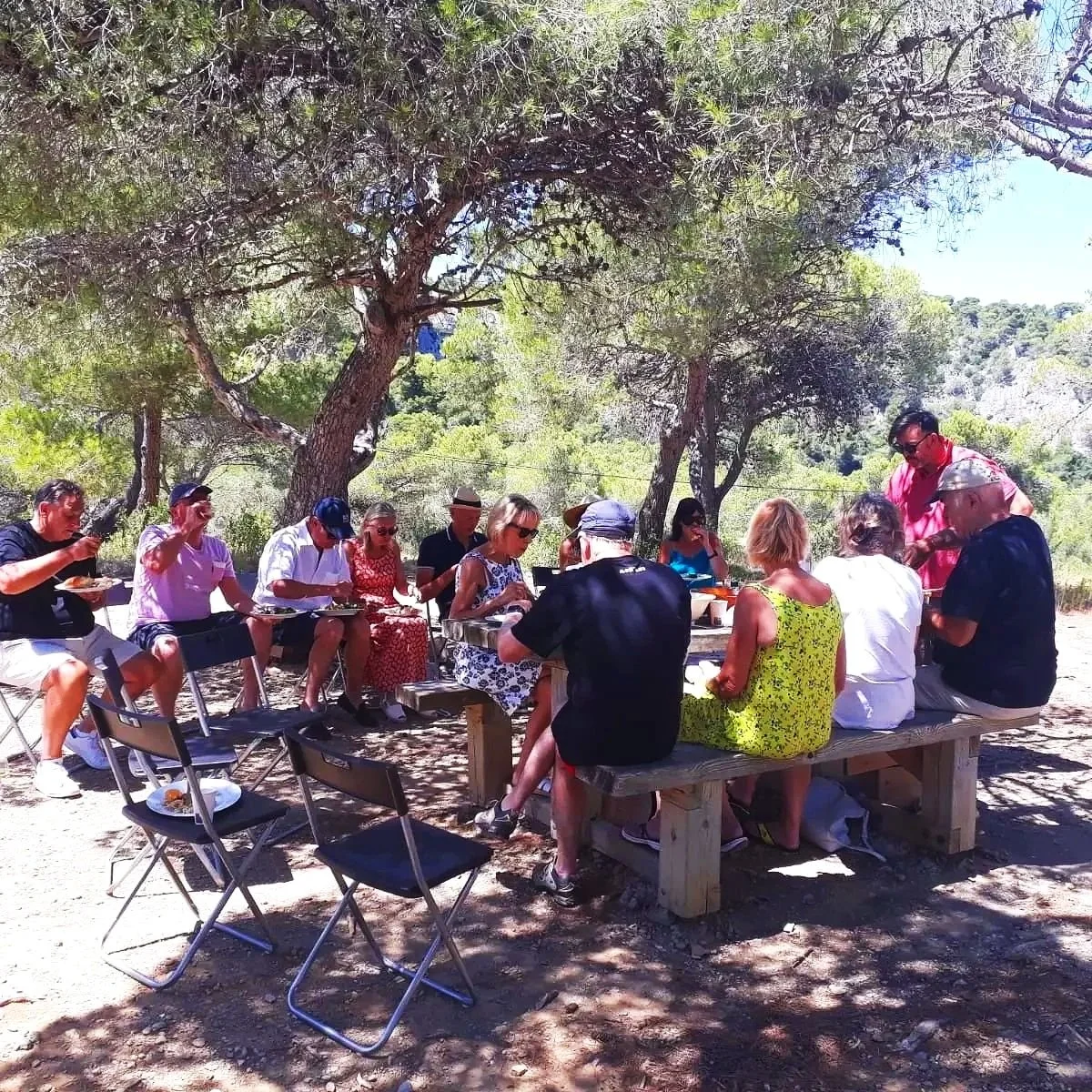 In a mediterranean garden, Matt is cooking for a small private group