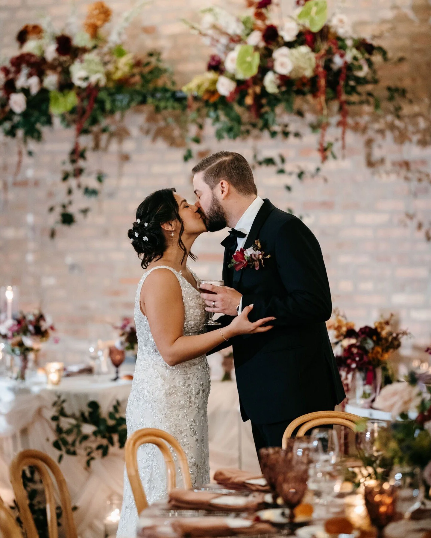 #WeddingWednesday: Marsha + Sean's November wedding at The Arbory in Chicago was a celebration defined by warmth, texture, and romance. Tucked into an industrial space on Grand Avenue, the venue&rsquo;s exposed elements and natural greenery created t