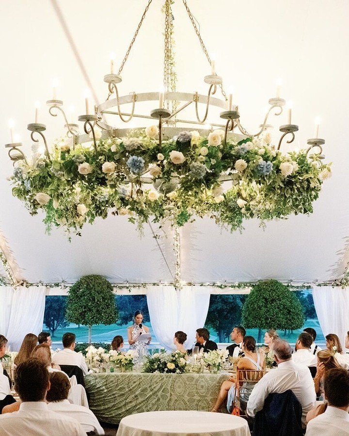 #WeddingWednesday: When the couple wants a floral chandelier, you pull out all the stops! 😍 

Tara and Ben's timeless green and white wedding included touches of soft, summer breeze blue. And of course, the floral star of their reception was a lush 