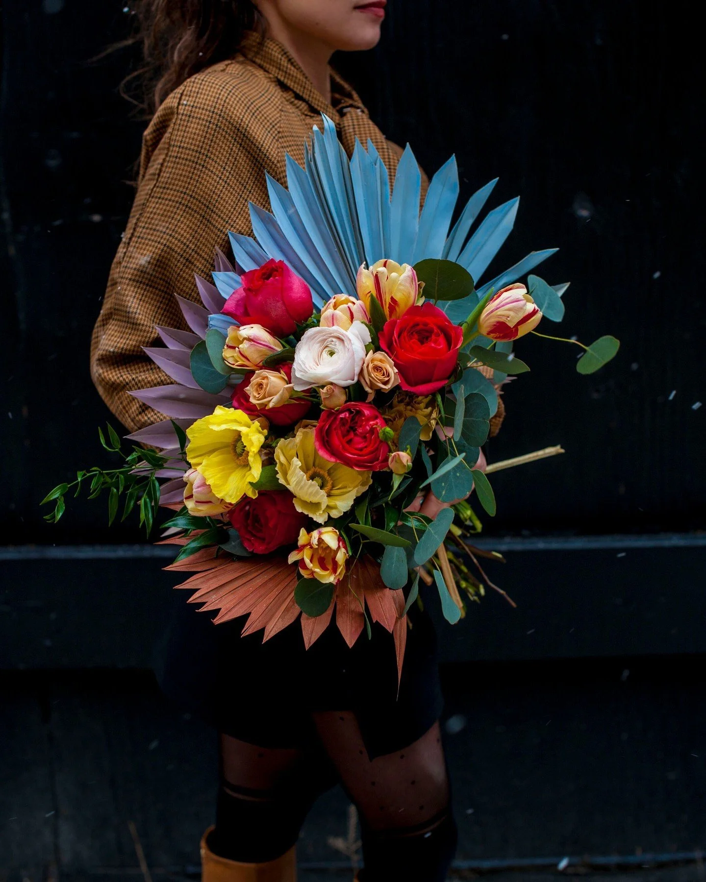 Floral fans are a fun way to add color, sculpture, and novelty to any arrangement. Made from dried palm leaves, they can either stay their natural white/tan color or be painted with flower spraypaint to really up the ante!

Can you find the floral fa
