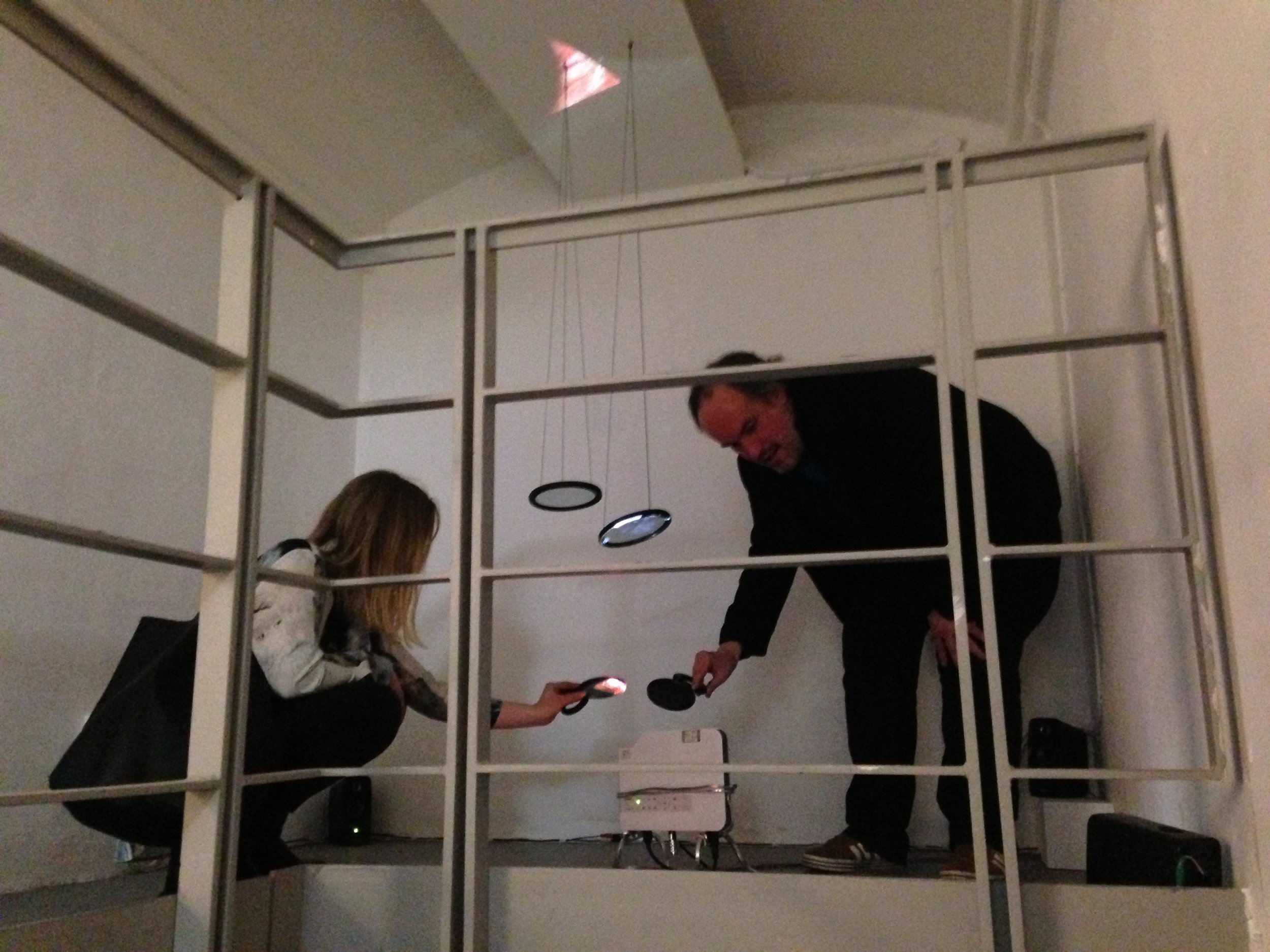  Two viewers exploring the projection using handheld mirrors 